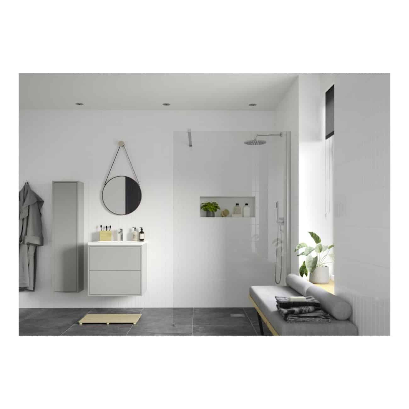 Sleek modern Bubly Bathroom featuring a minimalist shower area with built-in niche, contemporary vanity with storage, wall-mounted mirror, grey tiled flooring, and a cosy seating nook with lush plant decor for a stylish, functional space.