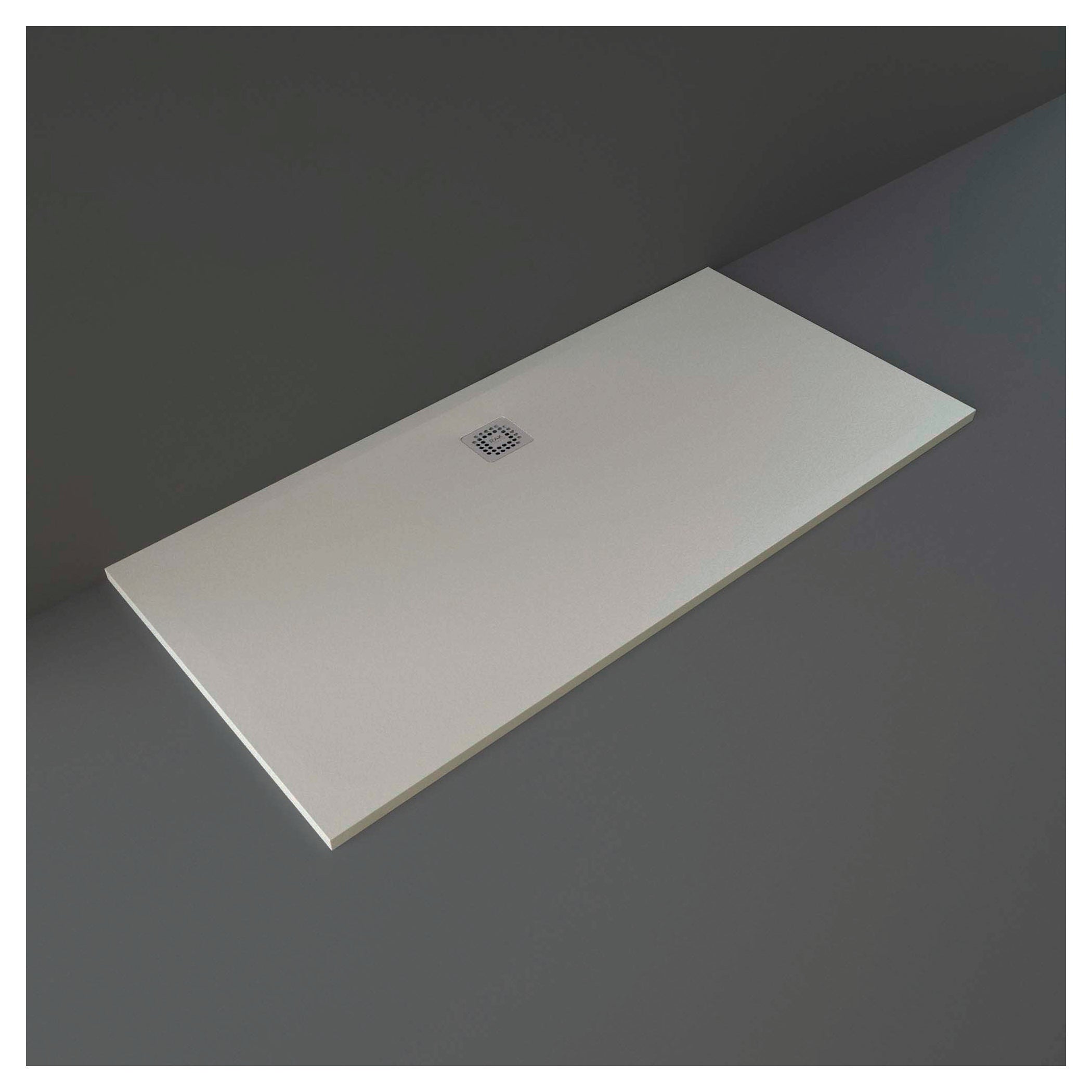 Modern white shower tray with central drain for contemporary bathroom designs, demonstrating durability and sleek aesthetics suitable for Bubly Bathrooms installations.