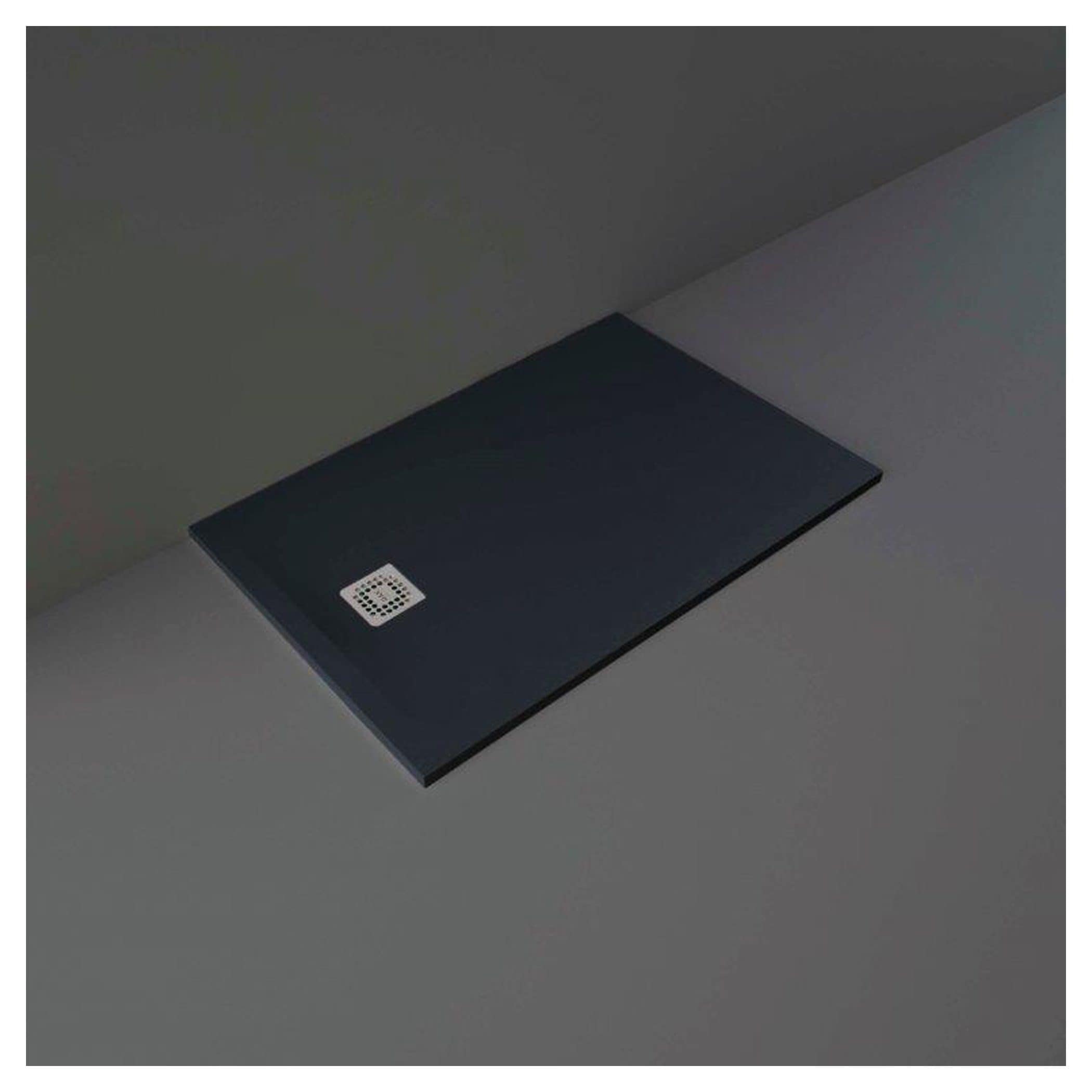 Sleek black shower drain with square design and stainless steel grate for modern Bubly bathroom aesthetics.