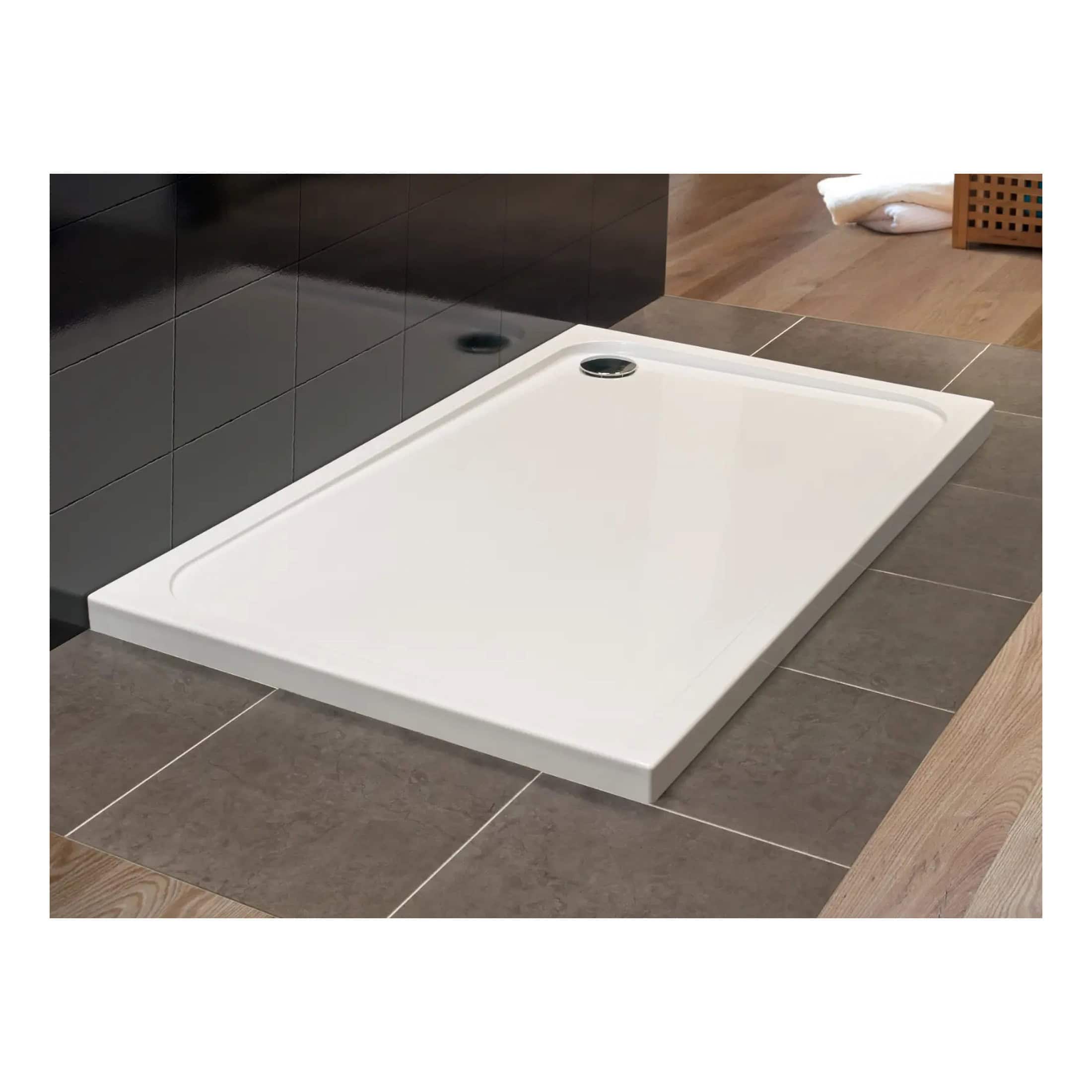 Modern white shower tray with a sleek rectangular design, ideal for contemporary bathroom renovations, featuring a low-profile edge and efficient water drainage system.