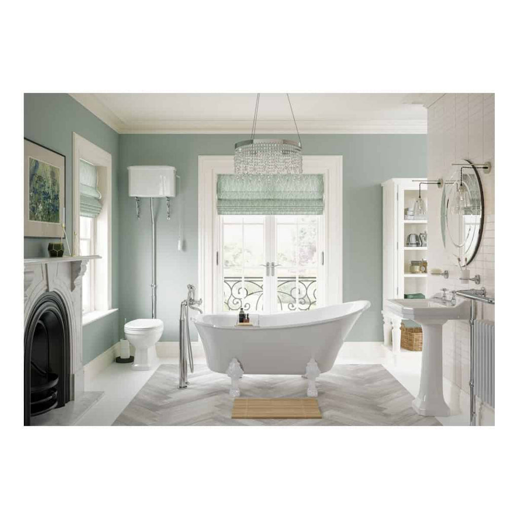 Elegant Victorian-inspired bathroom with freestanding clawfoot tub, classic fireplace, and white cabinetry, creating a serene and luxurious space for relaxation.