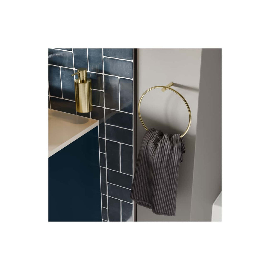 Shower towel ring with a grey towel, positioned next to a bathroom vanity with navy blue tiles and a gold soap dispenser, illustrating modern bathroom accessories.