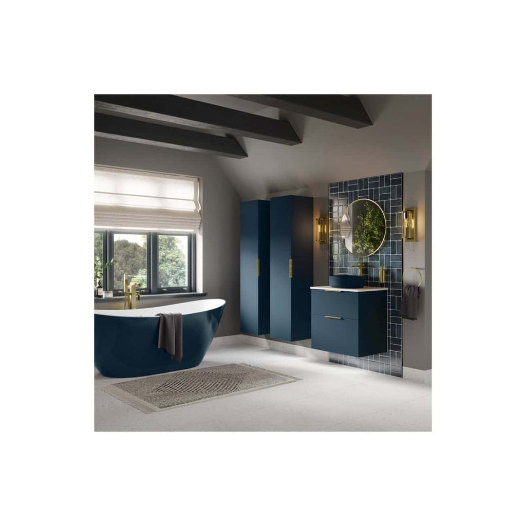 Stylish navy blue bathroom with a modern freestanding bathtub, gold fixtures, a sleek vanity unit, and decorative wall tiles, perfect for contemporary luxury bathroom designs.
