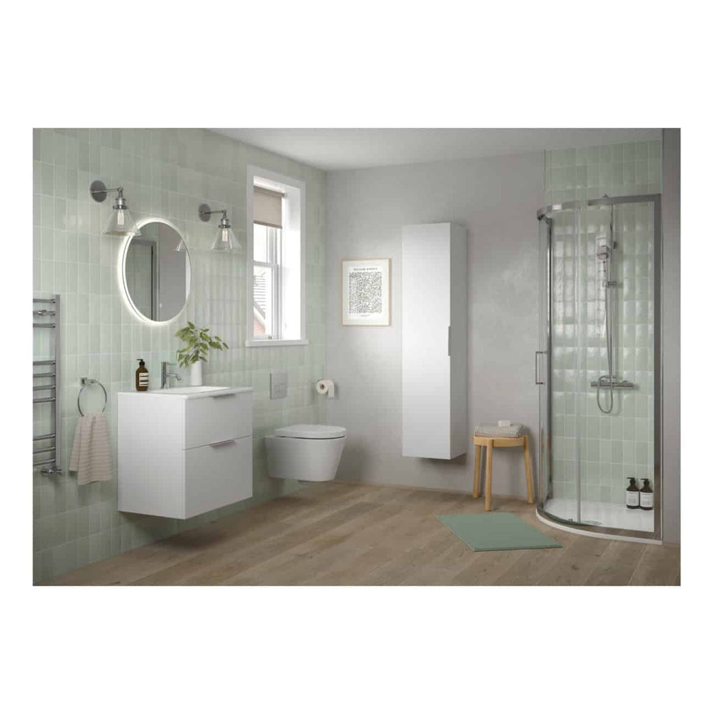 Sleek modern bathroom with green tiled walls, wall-mounted vanity unit, illuminated mirror, walk-in shower enclosure, and natural wooden accents for a minimalist bathroom design.