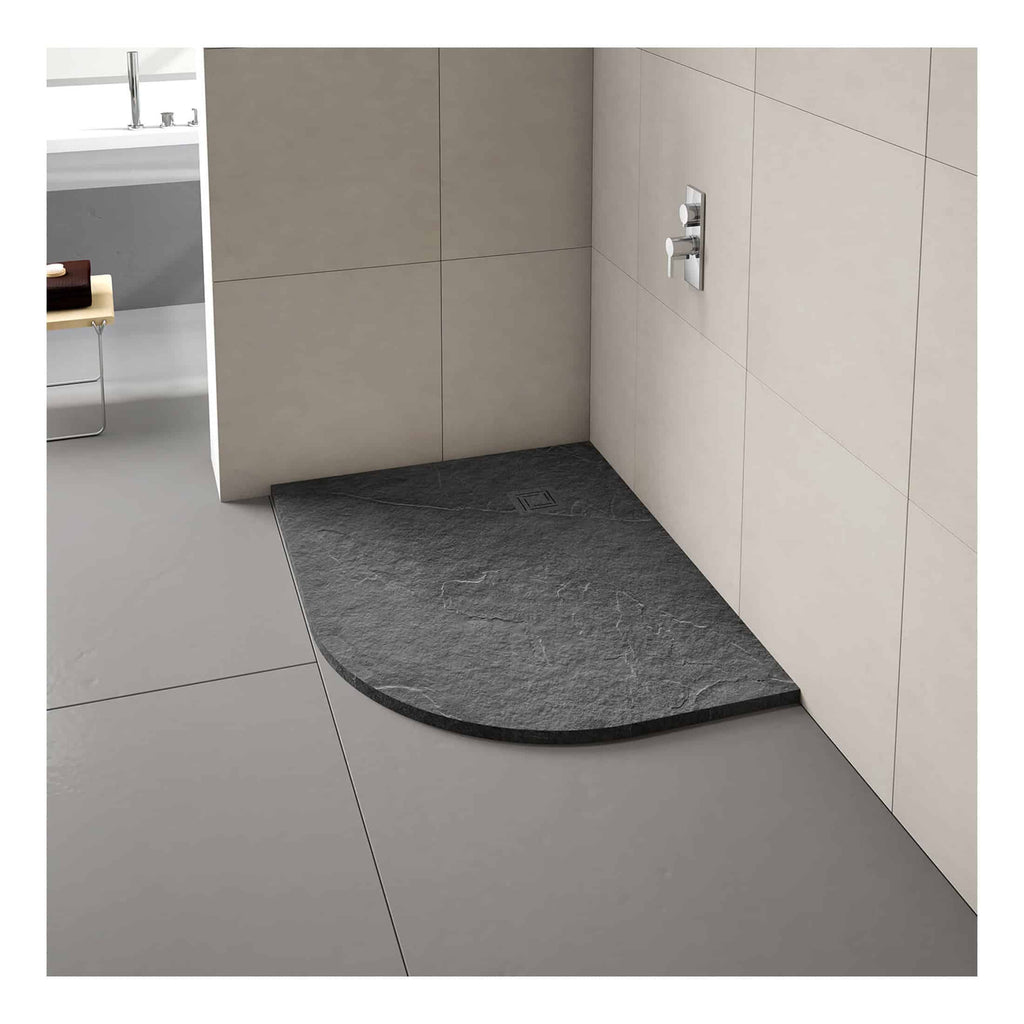 Slate shower tray with curved front, modern bathroom flooring, grey tiles, contemporary shower controls, stylish minimalistic design, durable waterproof shower base, Bubly Bathrooms collection.