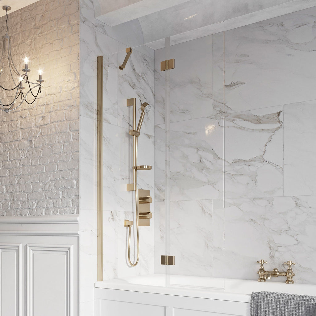 Modern luxury bathroom shower with gold fixtures, marble wall tiles, and glass partition, reflecting elegant and stylish bathroom design ideas.