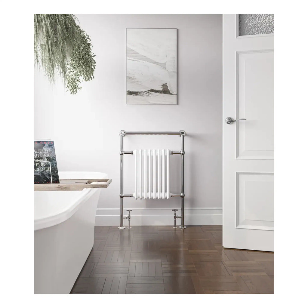 Polished chrome towel radiator in modern bathroom with white walls and wooden flooring. Elegant bathroom design with minimalist style, perfect for contemporary home decor.