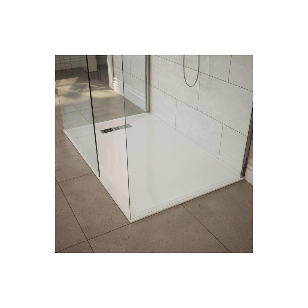 Modern frameless glass shower enclosure with white shower tray and beige wall tiles, designed for luxury bathroom renovations by Bubly Bathrooms.