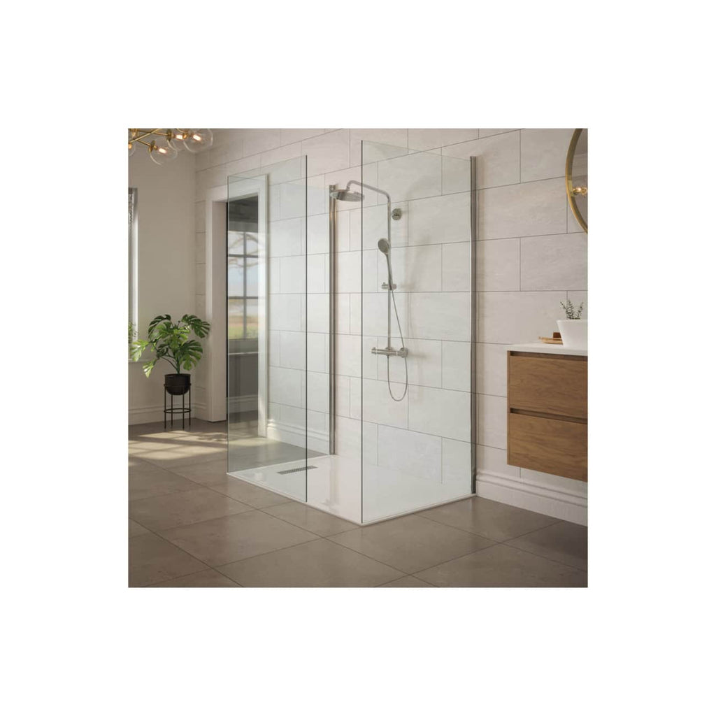 Sleek walk-in shower with frameless glass enclosure, modern chrome fixtures, and white tiled walls in a contemporary bathroom setting. Perfect for stylish and functional bathroom interiors.