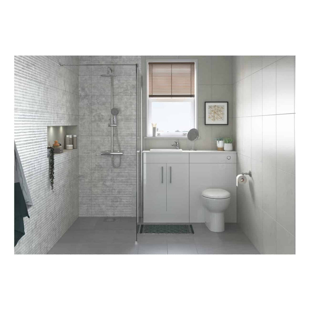 Sleek modern bathroom with a walk-in shower, white vanity, and toilet, featuring minimalist decor, natural light from a window, and stylish accessories, perfect for contemporary bathroom design.