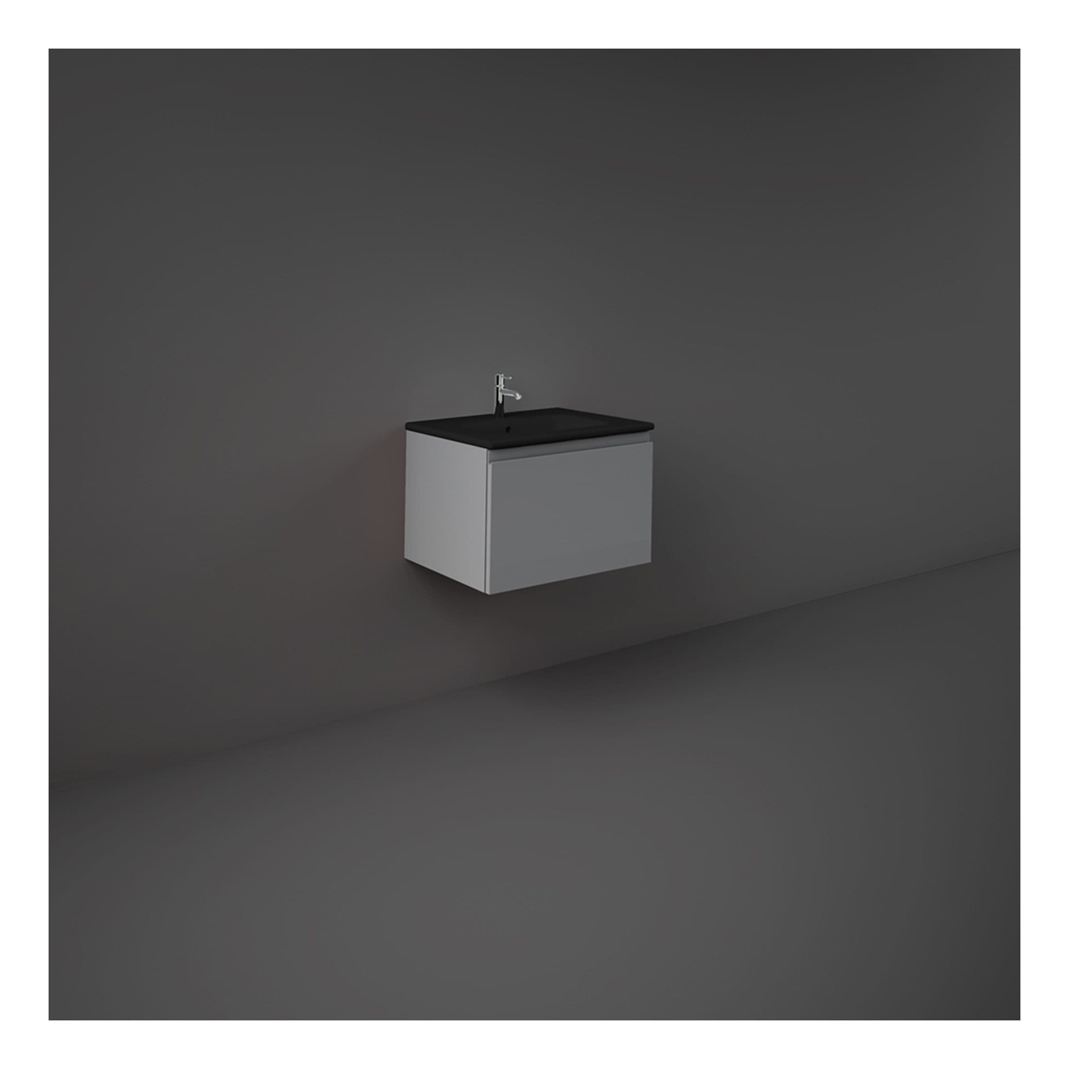 Modern minimalist bathroom vanity with black countertop and sleek white cabinet, featuring a contemporary chrome faucet, designed for stylish and functional bathroom interiors.