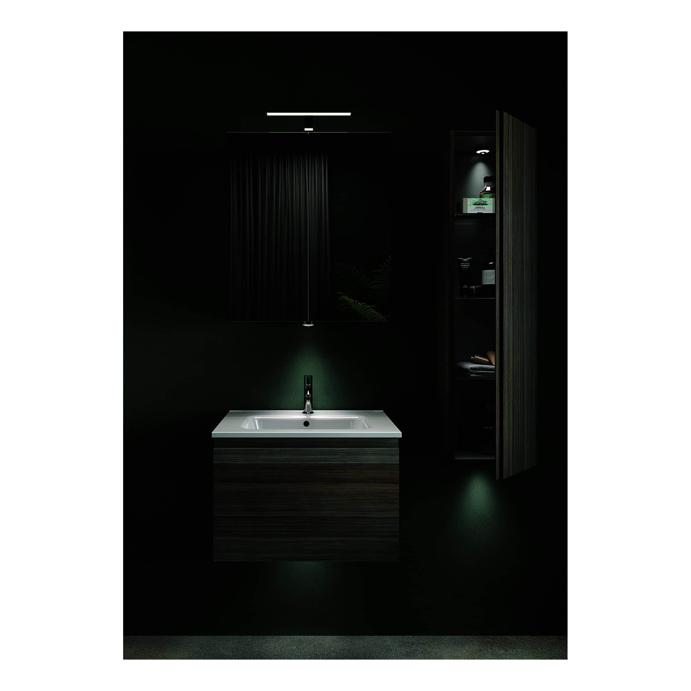 Sleek bathroom vanity with integrated sink, dark wood finish, modern black faucet, illuminated mirror, and black cabinetry with storage, creating a contemporary and minimalist bathroom design.
