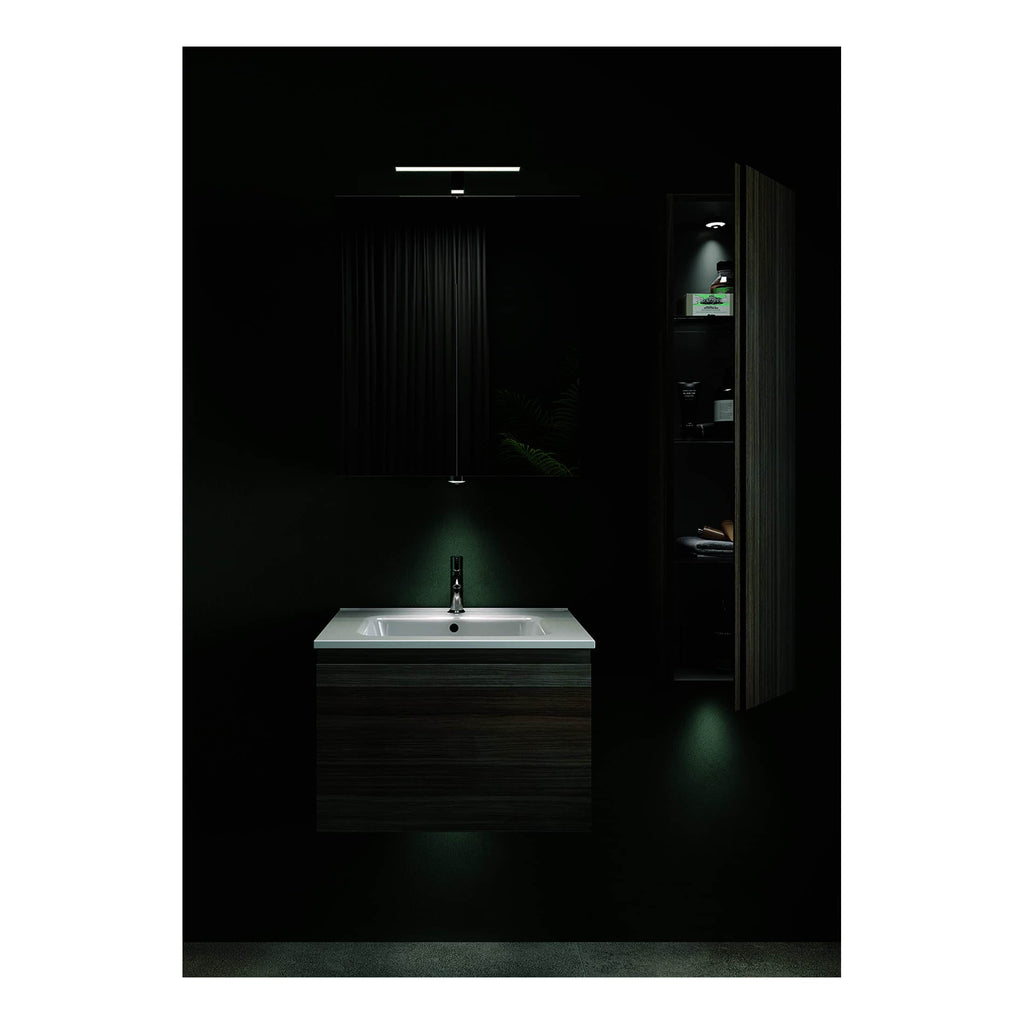 Sleek bathroom vanity with integrated sink, dark wood finish, modern black faucet, illuminated mirror, and black cabinetry with storage, creating a contemporary and minimalist bathroom design.