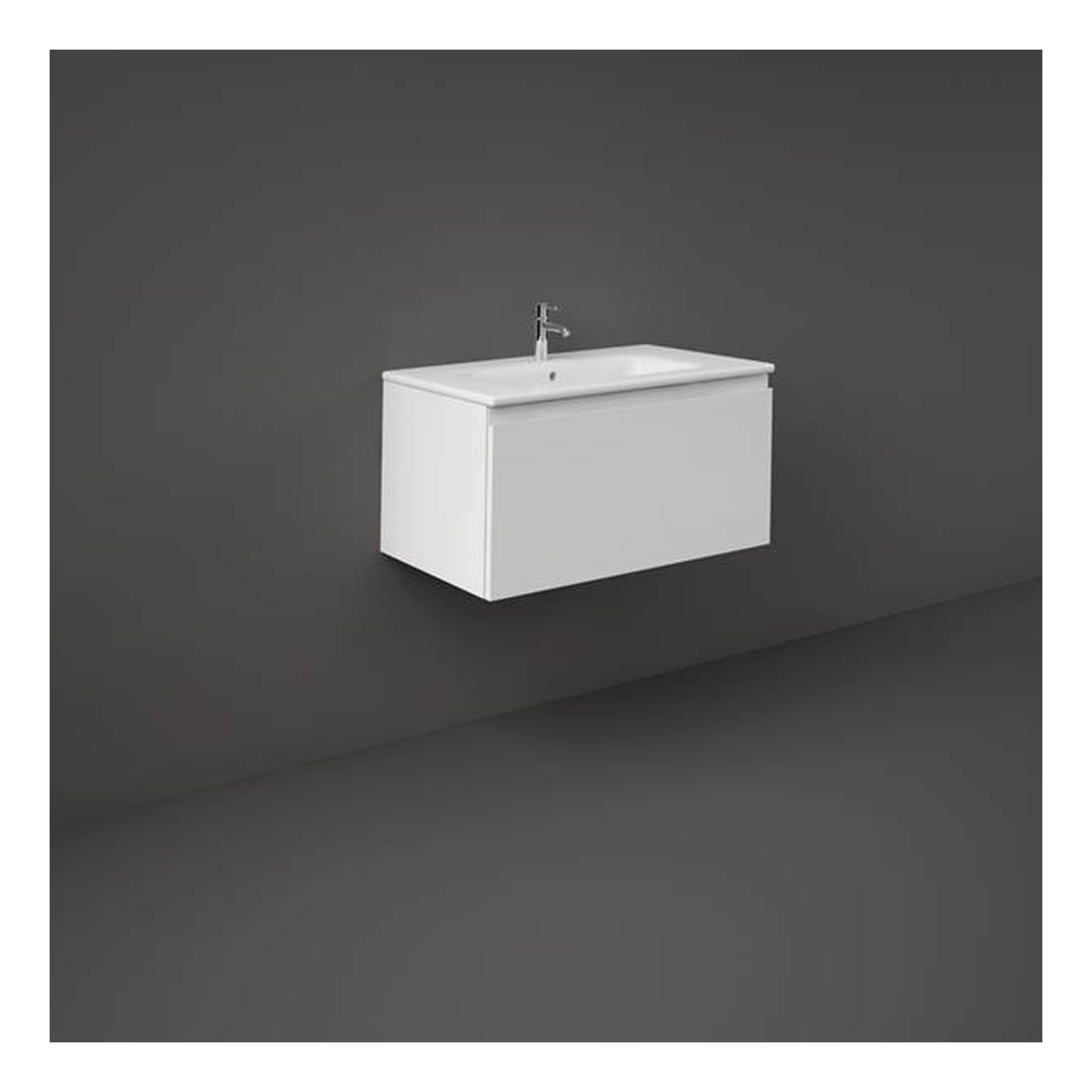 Sleek white bathroom vanity unit with integrated sink and modern tap, ideal for contemporary baths or cloakrooms, offering stylish storage and functional design.