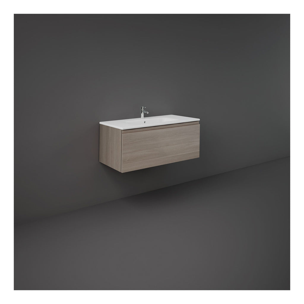 Modern wall-mounted bathroom vanity with a sleek white ceramic sink and light wood finish cabinet, ideal for contemporary bathroom decor and efficient space utilisation.