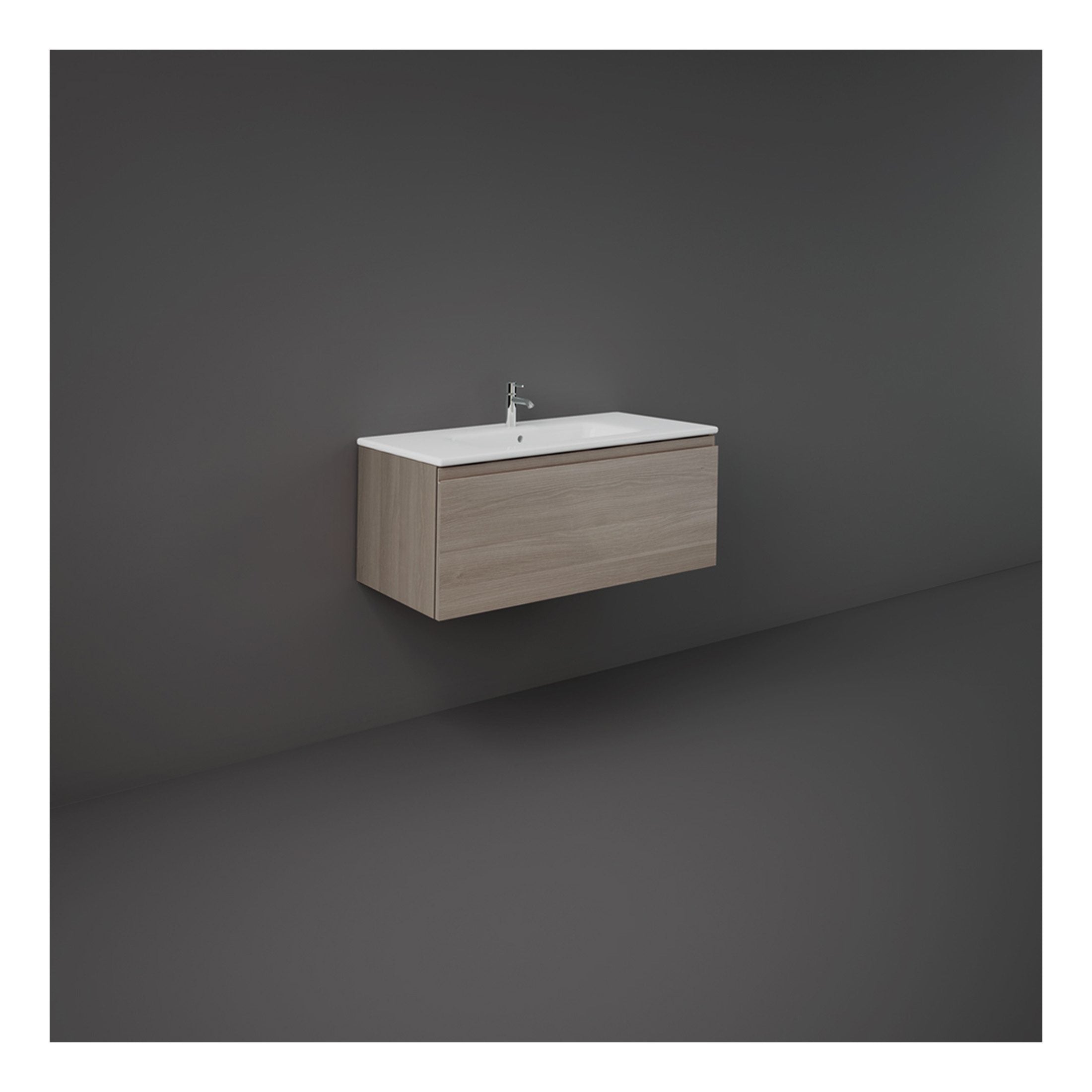 Modern wall-mounted bathroom vanity with a sleek white ceramic sink and light wood finish cabinet, ideal for contemporary bathroom decor and efficient space utilisation.