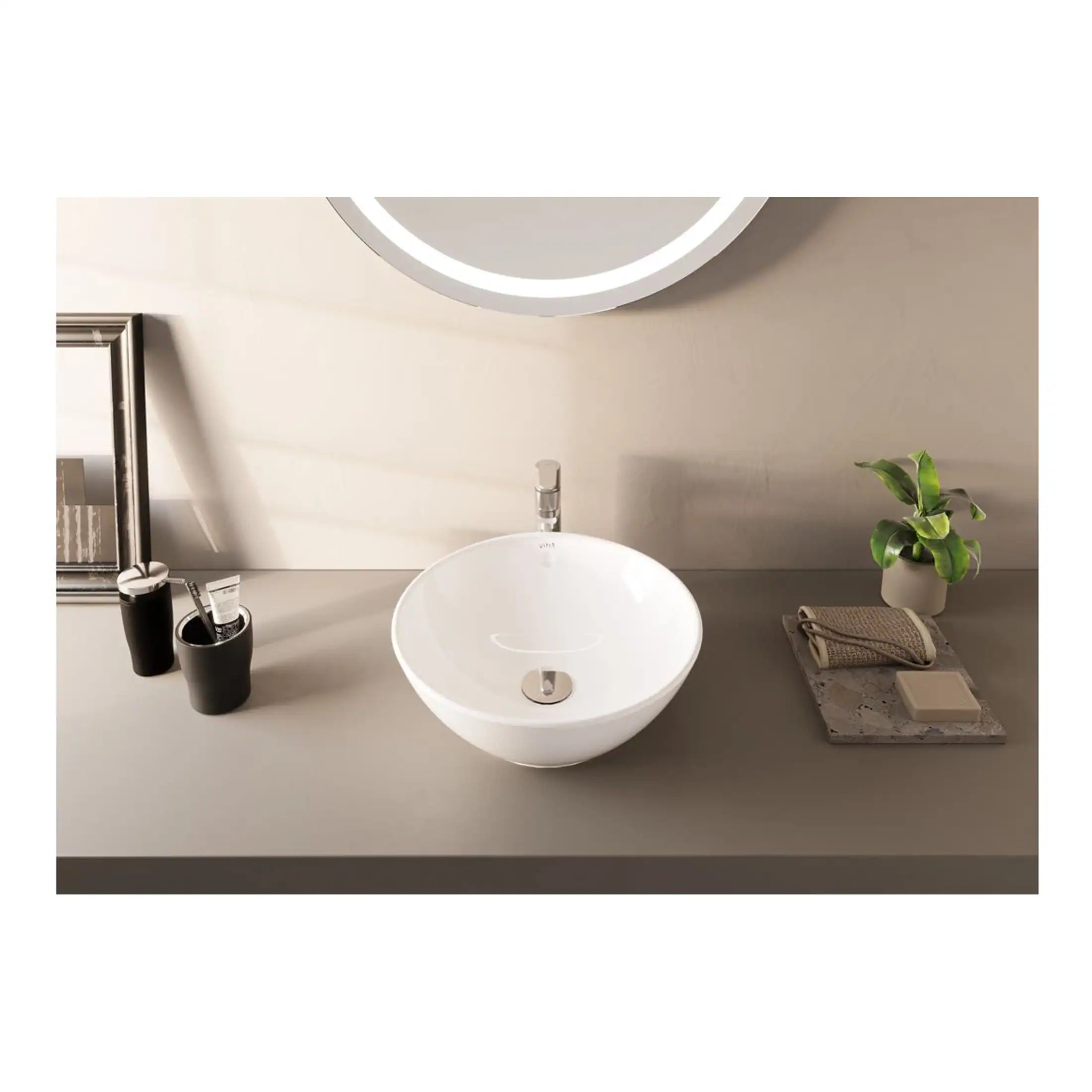 Sleek white bathroom basin with modern chrome tap on a minimalist grey countertop, complemented by black accessories, a mirror, potted plant, and stylish toiletries.