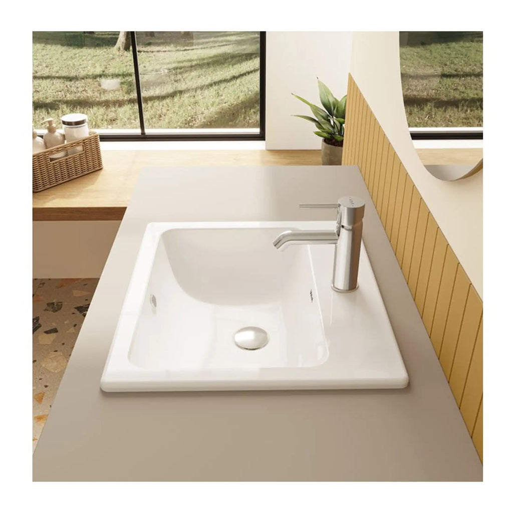 Shower tray and modern chrome faucet in minimalistic bathroom with a large window and natural decor.