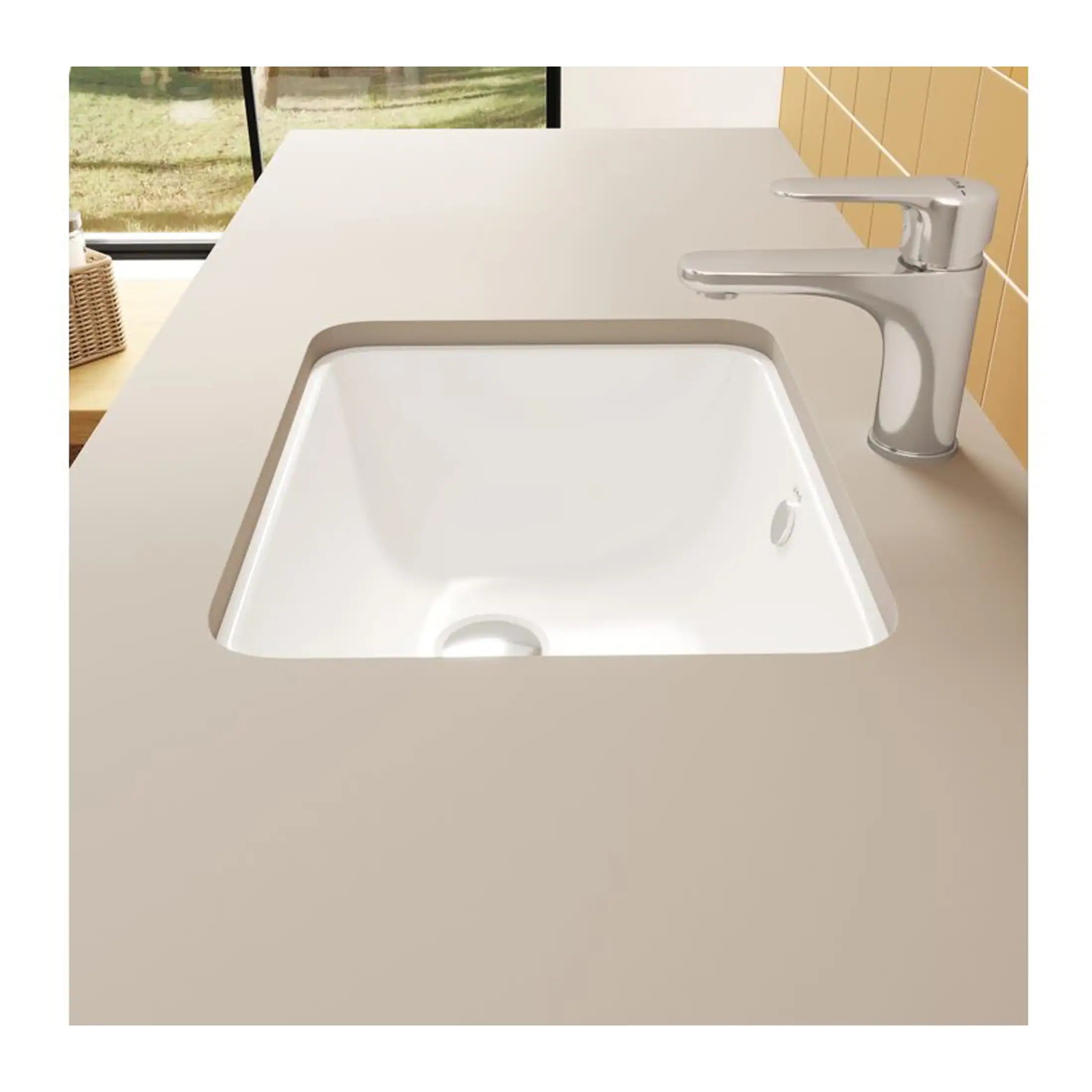 Sleek white kitchen sink with modern chrome tap in a contemporary kitchen setting, featuring a beige countertop and large window, perfect for modern bathroom and kitchen renovations.