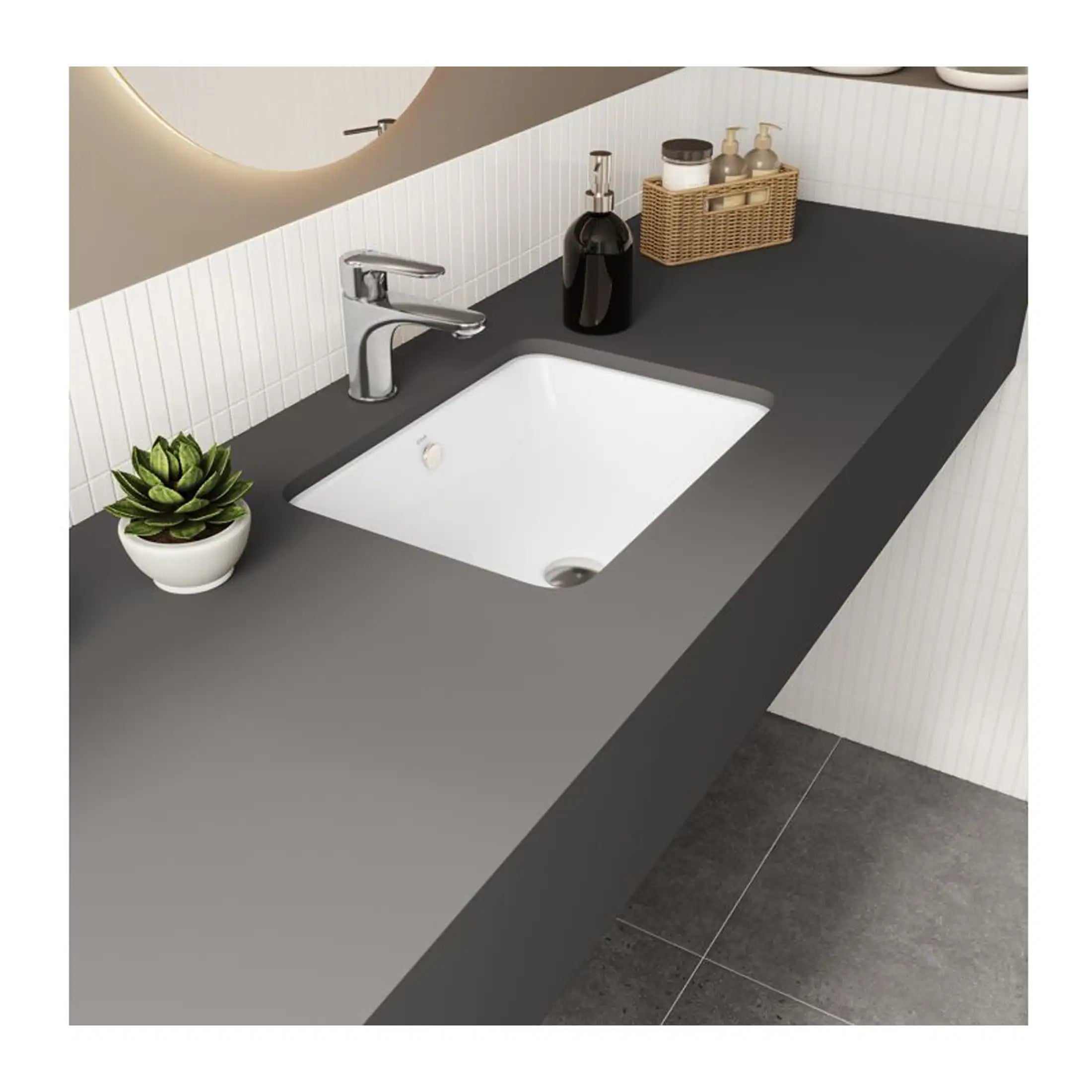 Sleek modern bathroom vanity with a black countertop, white undermount sink, chrome tap, and stylish accessories, perfect for contemporary bathroom design.