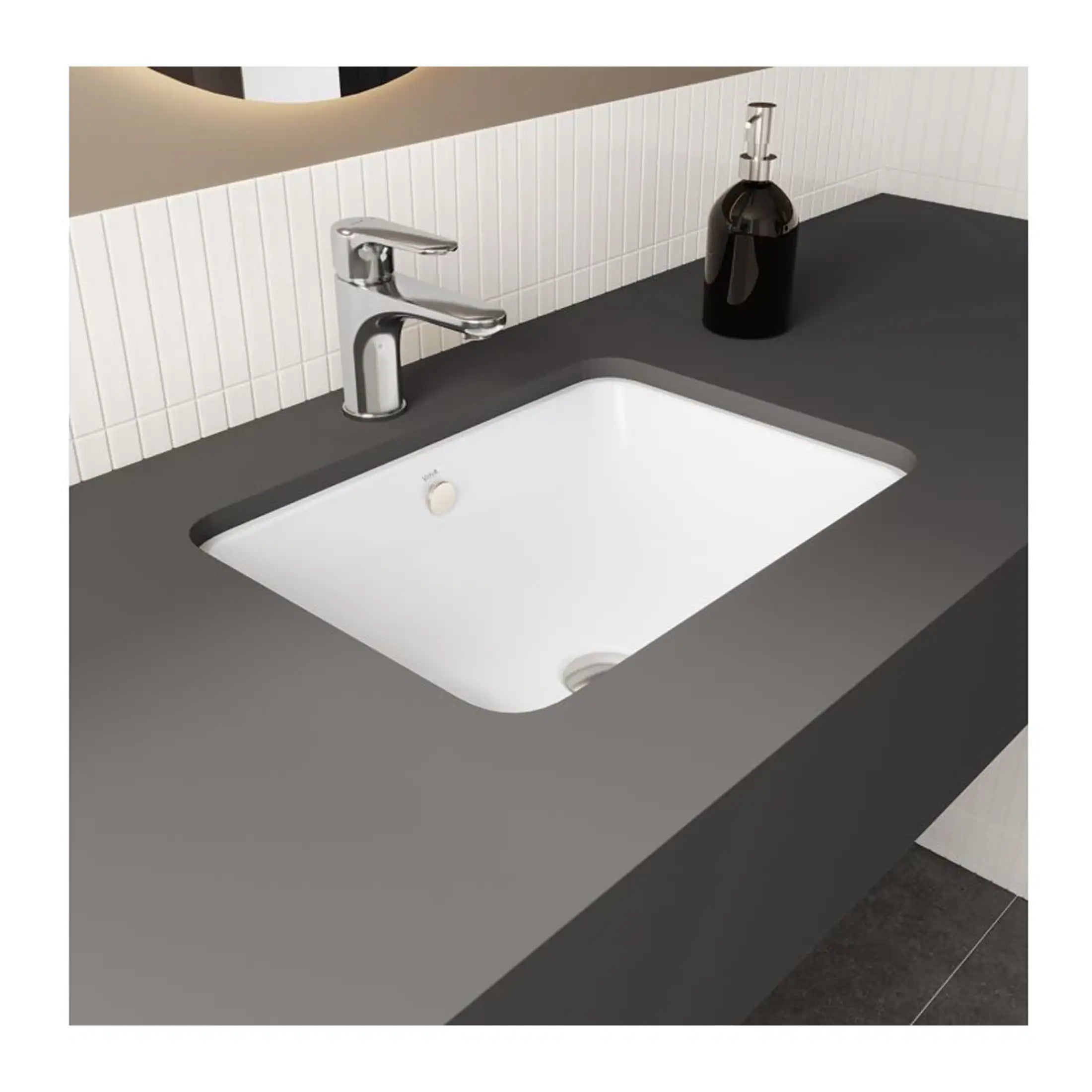 Modern white bathroom sink with sleek chrome tap and black soap dispenser, set in a minimalist bathroom. Ideal for contemporary bathroom renovations, combining functionality with stylish design.