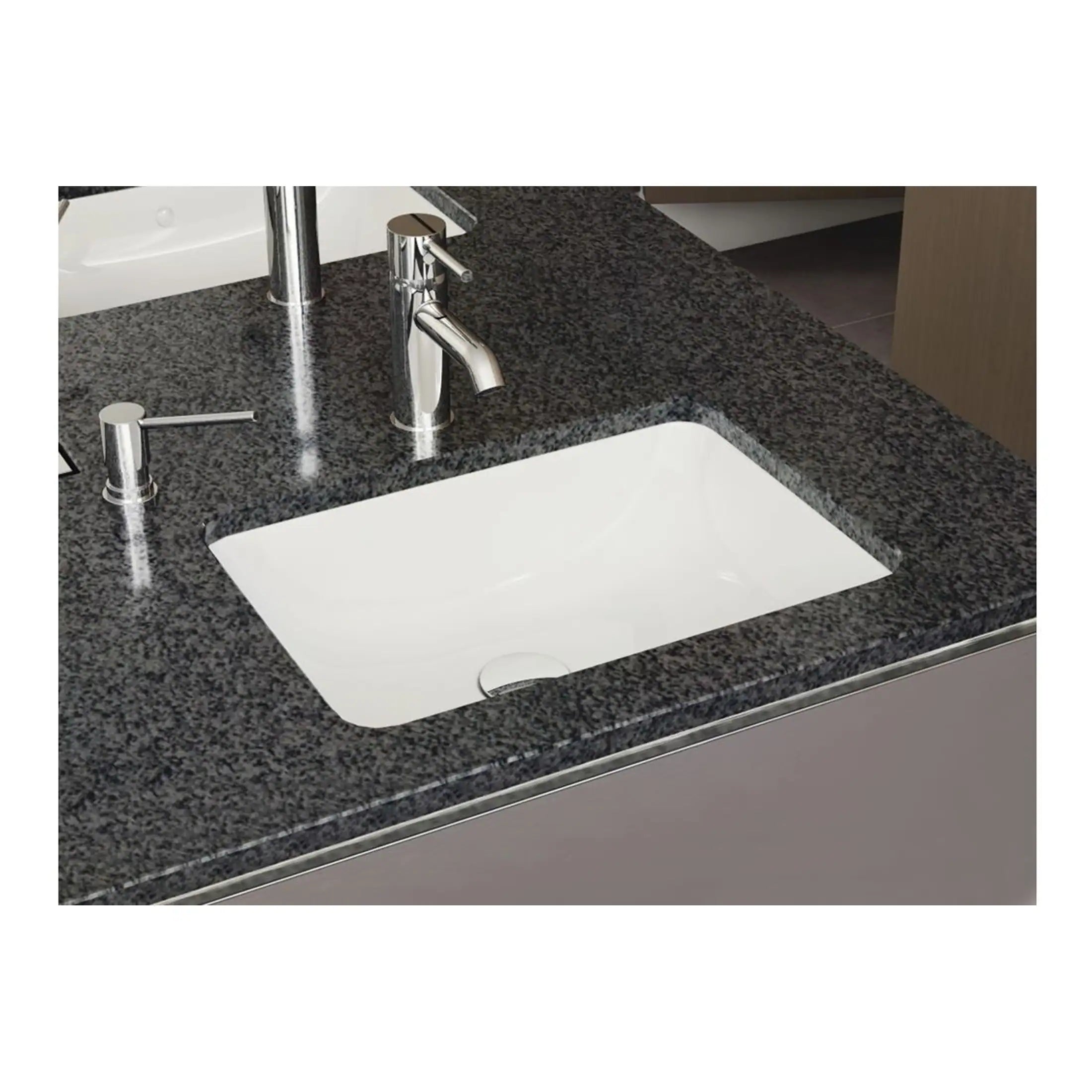 Sleek white bathroom sink with modern chrome tap and accessories on a polished black granite countertop, showcasing premium bathroom fittings and stylish design by Bubly Bathrooms.