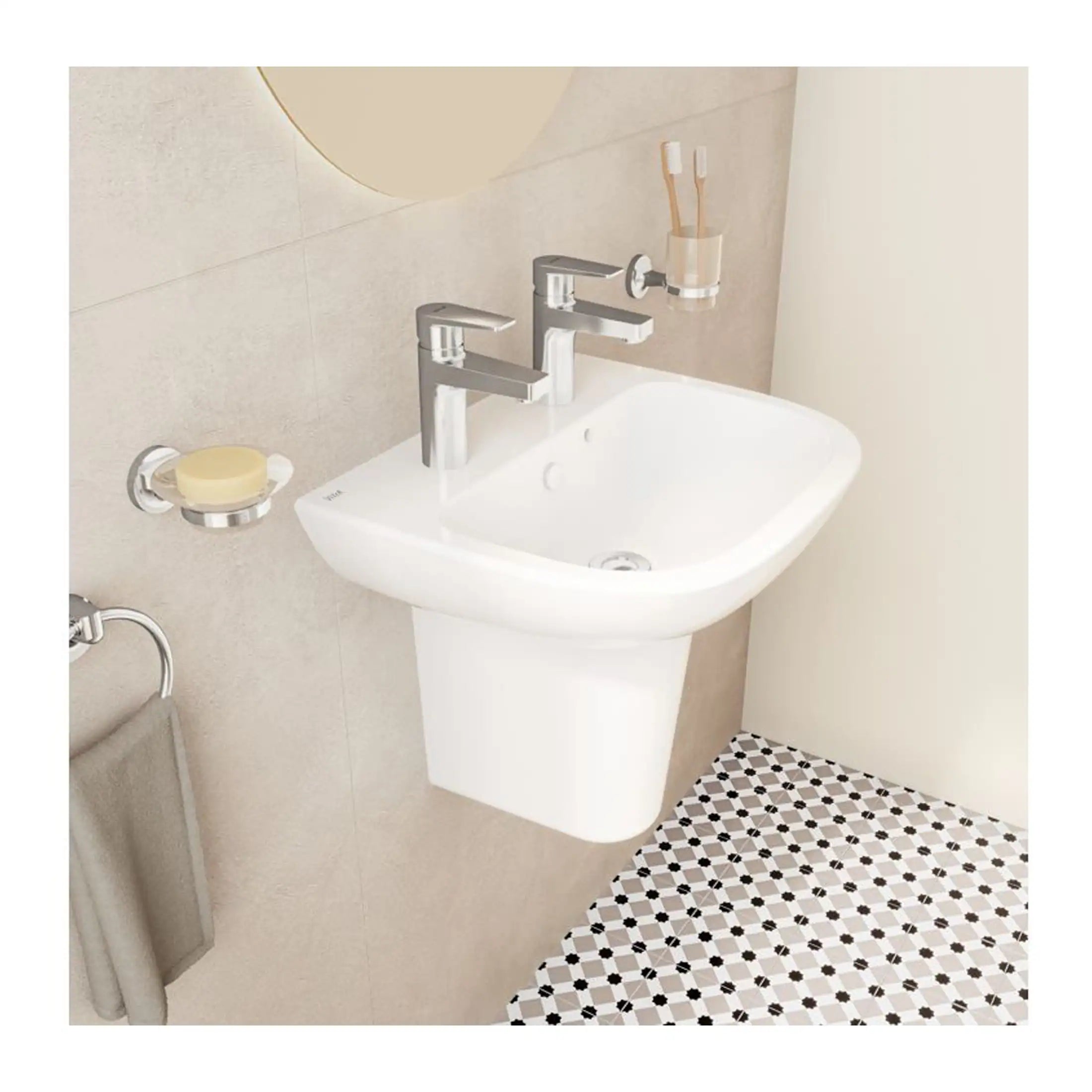 Bright white wall-mounted bathroom sink with dual chrome taps, set against beige tiled wall, featuring a soap dish, toothbrush holder, and patterned black and white floor tiles, showcasing modern bathroom design.