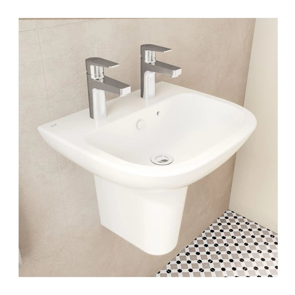 Modern white bathroom sink with twin chrome taps, wall-mounted basin in contemporary bathroom setting, featuring clean design and functional style.