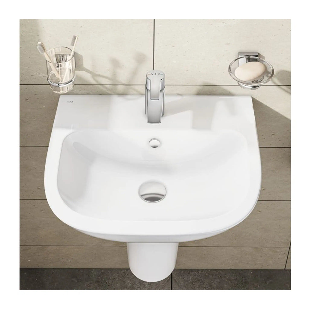 Sleek white bathroom sink with modern faucet and wall-mounted accessories, ideal for contemporary bathroom designs and plumbing installations.