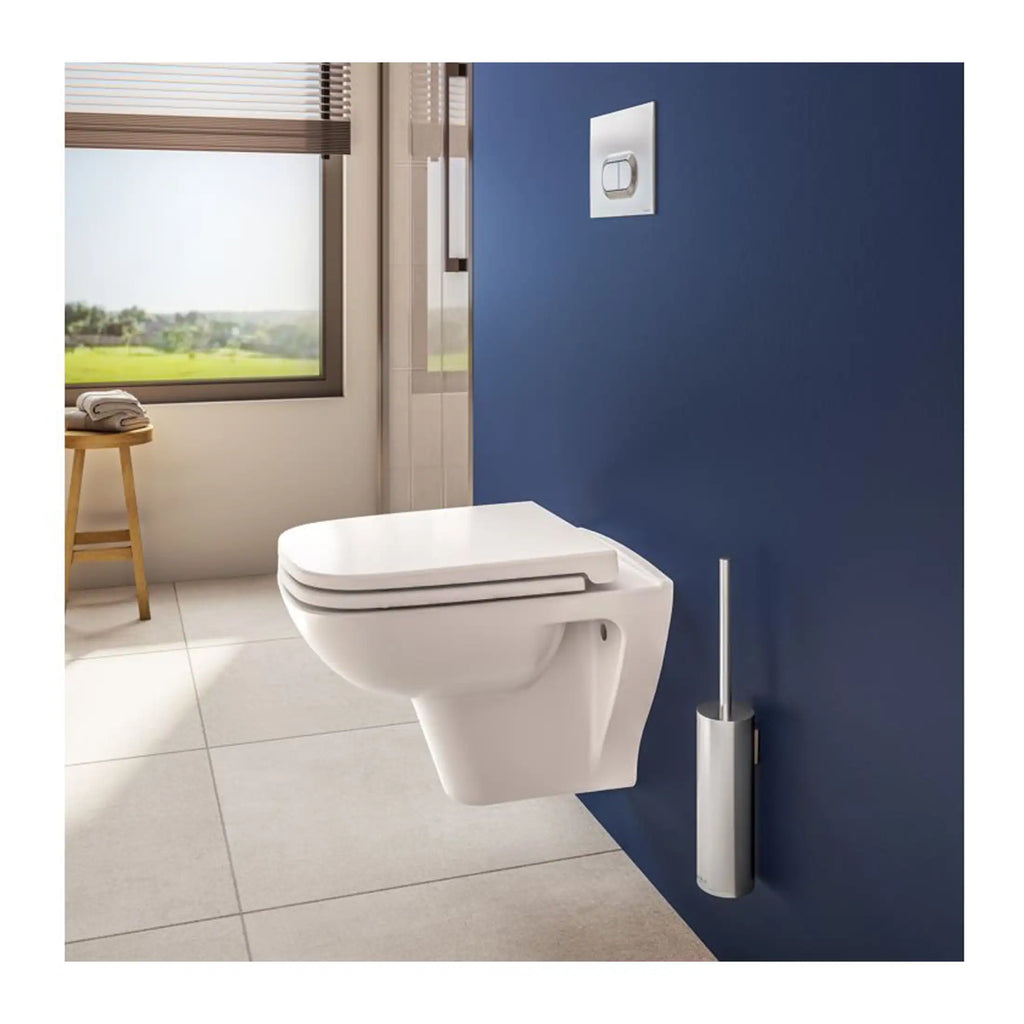 Flush toilet with modern design in a contemporary bathroom setting featuring a blue accent wall and a toilet brush holder, ideal for luxury bathroom interiors.