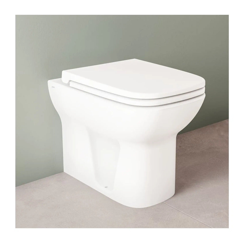 Modern white close-coupled toilet with soft-close seat, ideal for contemporary bathroom designs, showcasing high-quality sanitary ware from Bubly Bathrooms.