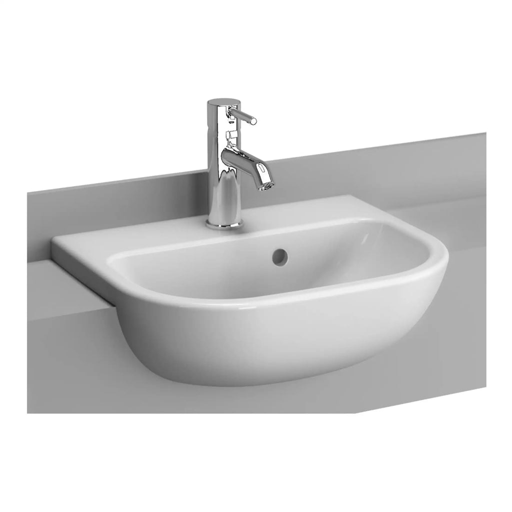 Modern white bathroom sink with chrome faucet mounted on grey countertop for elegant bathroom design.