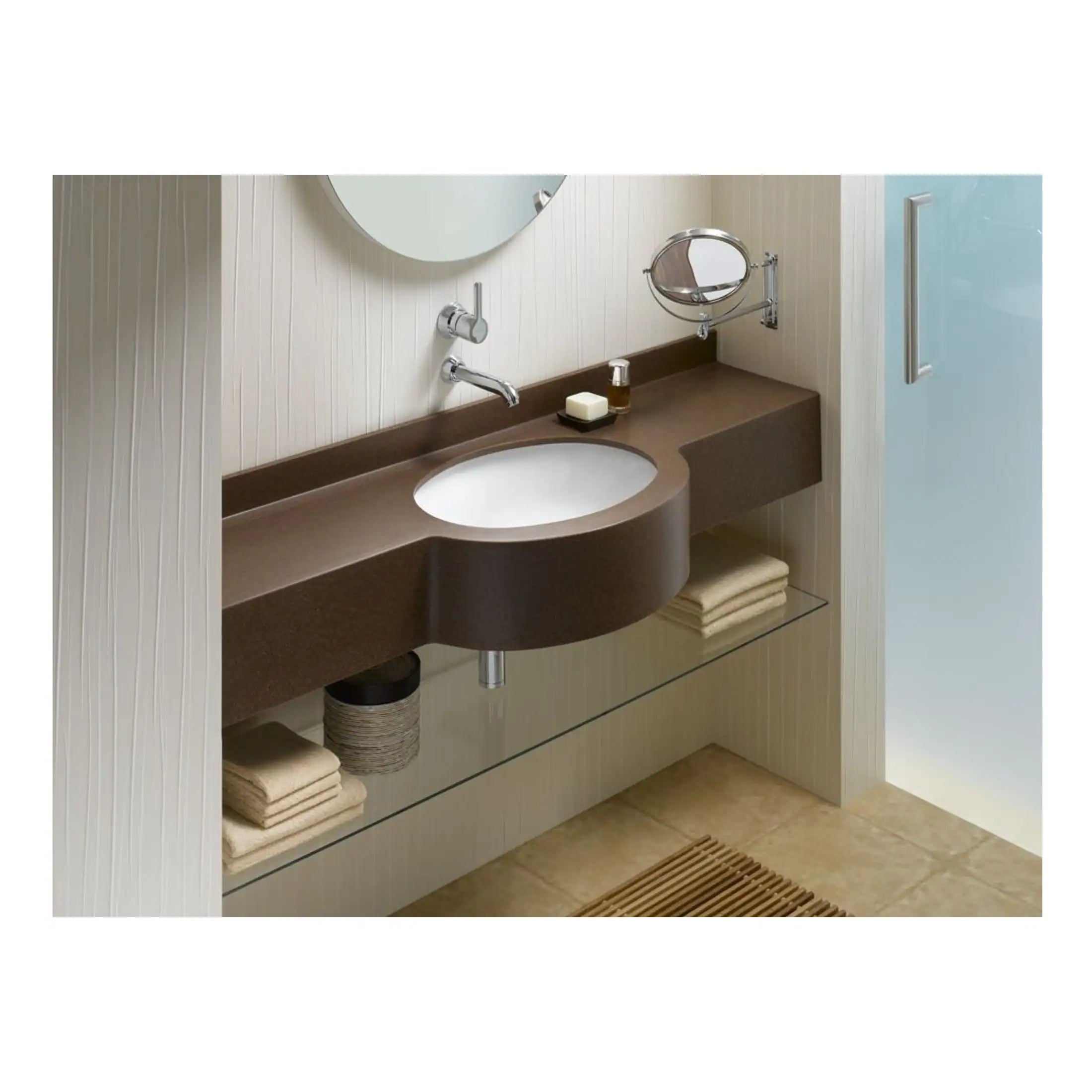 Bright modern bathroom featuring a stylish brown countertop sink, a round mirror, and neatly folded towels underneath, creating a functional and sleek bathroom design.