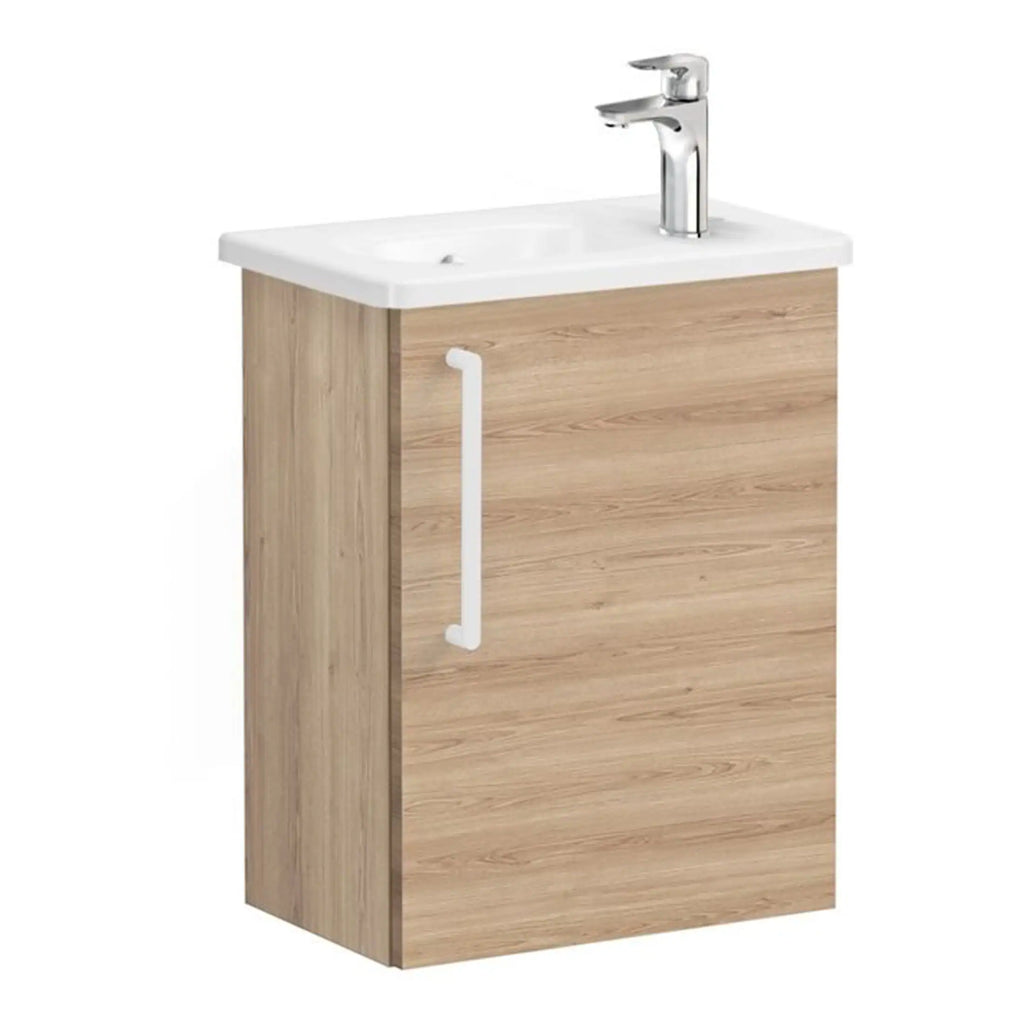 Modern bathroom vanity unit with a white ceramic sink and chrome tap, made from natural wood effect MDF with a white door handle, ideal for contemporary bathroom refurbishment.