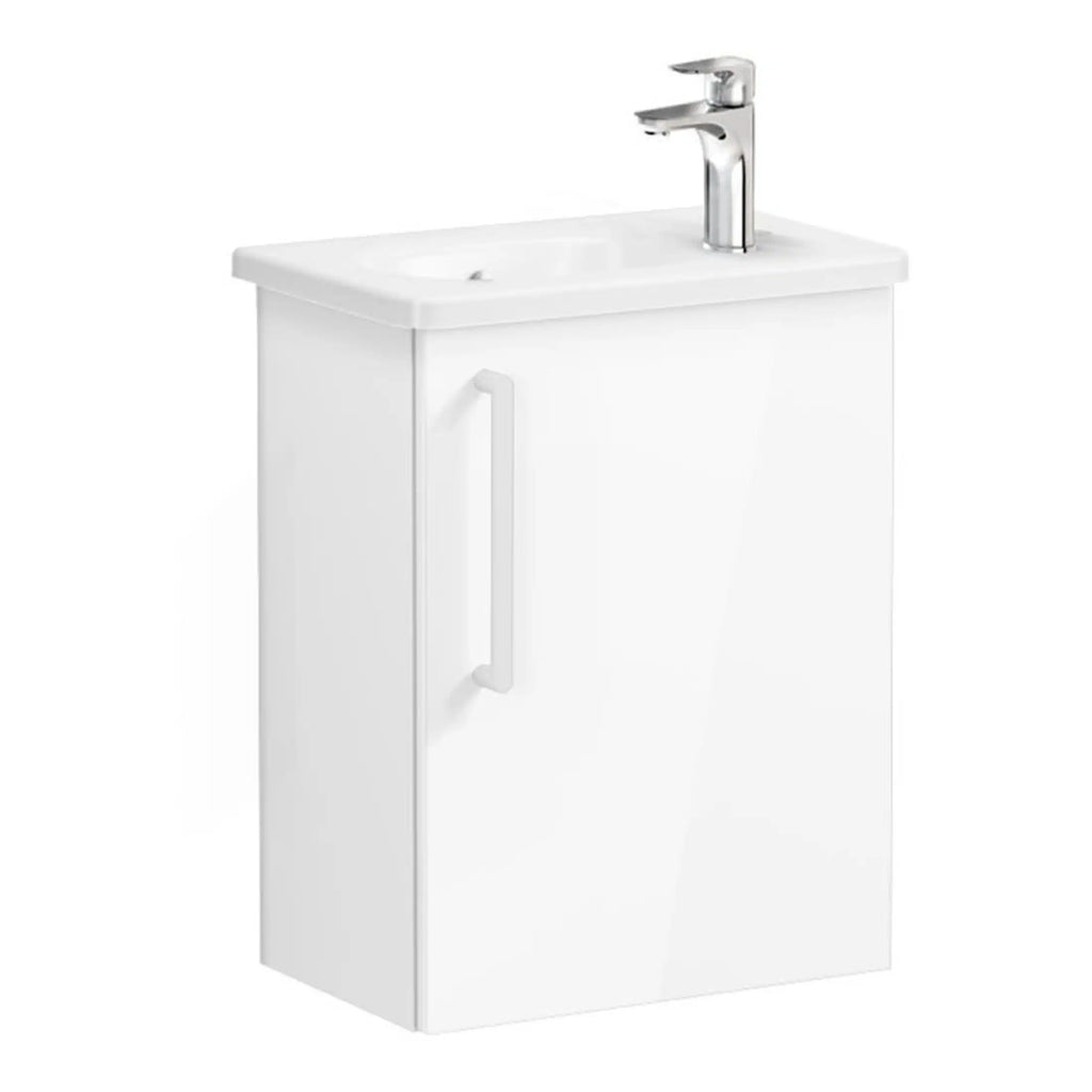 White bathroom vanity unit with integrated sink and chrome tap, ideal for modern bathroom and washroom designs. Durable cabinetry with handle for easy access and sleek, clean aesthetics.