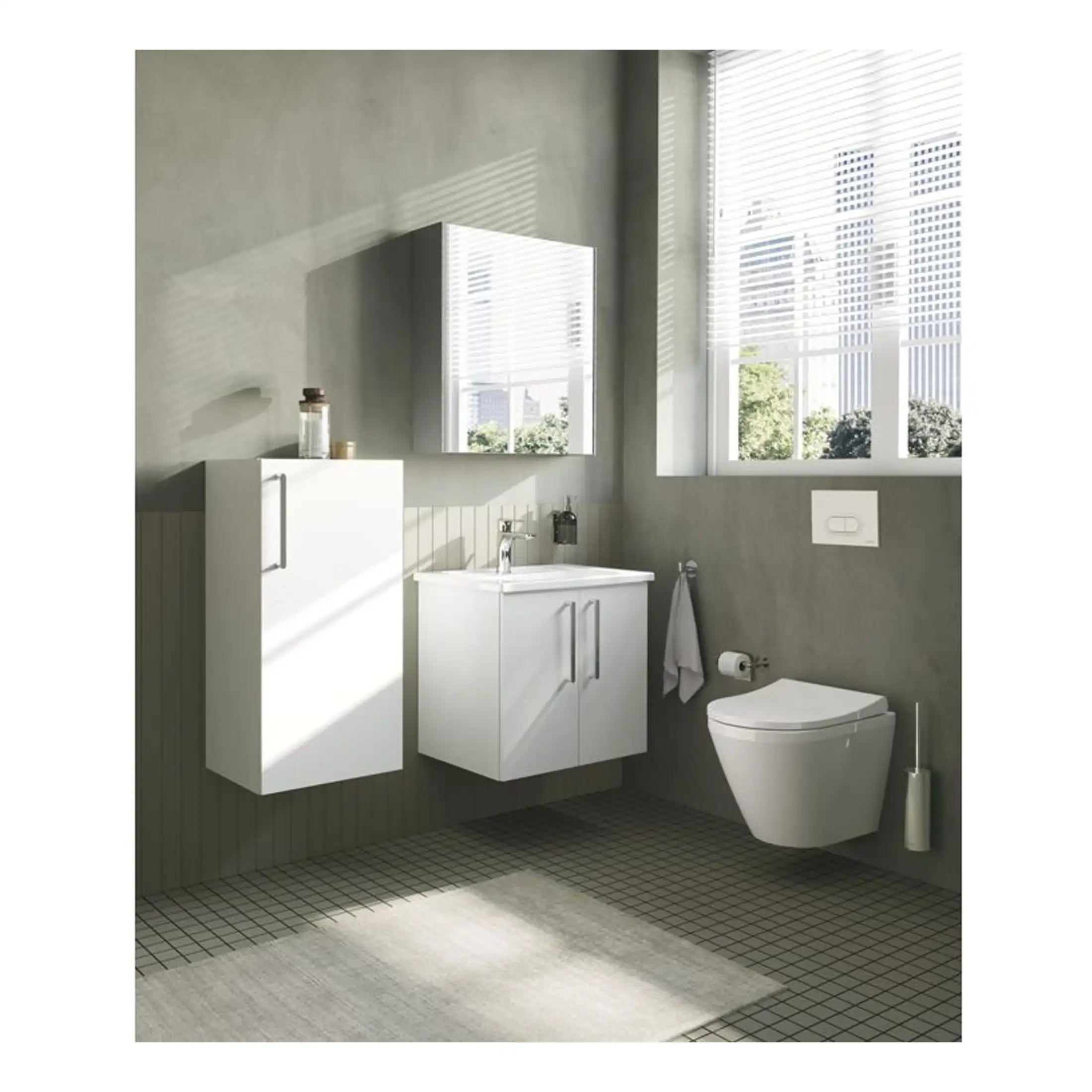 Sleek modern bathroom with white cabinetry, wall-mounted toilet, large window with blinds, and neutral grey walls, perfect for contemporary bathroom design.