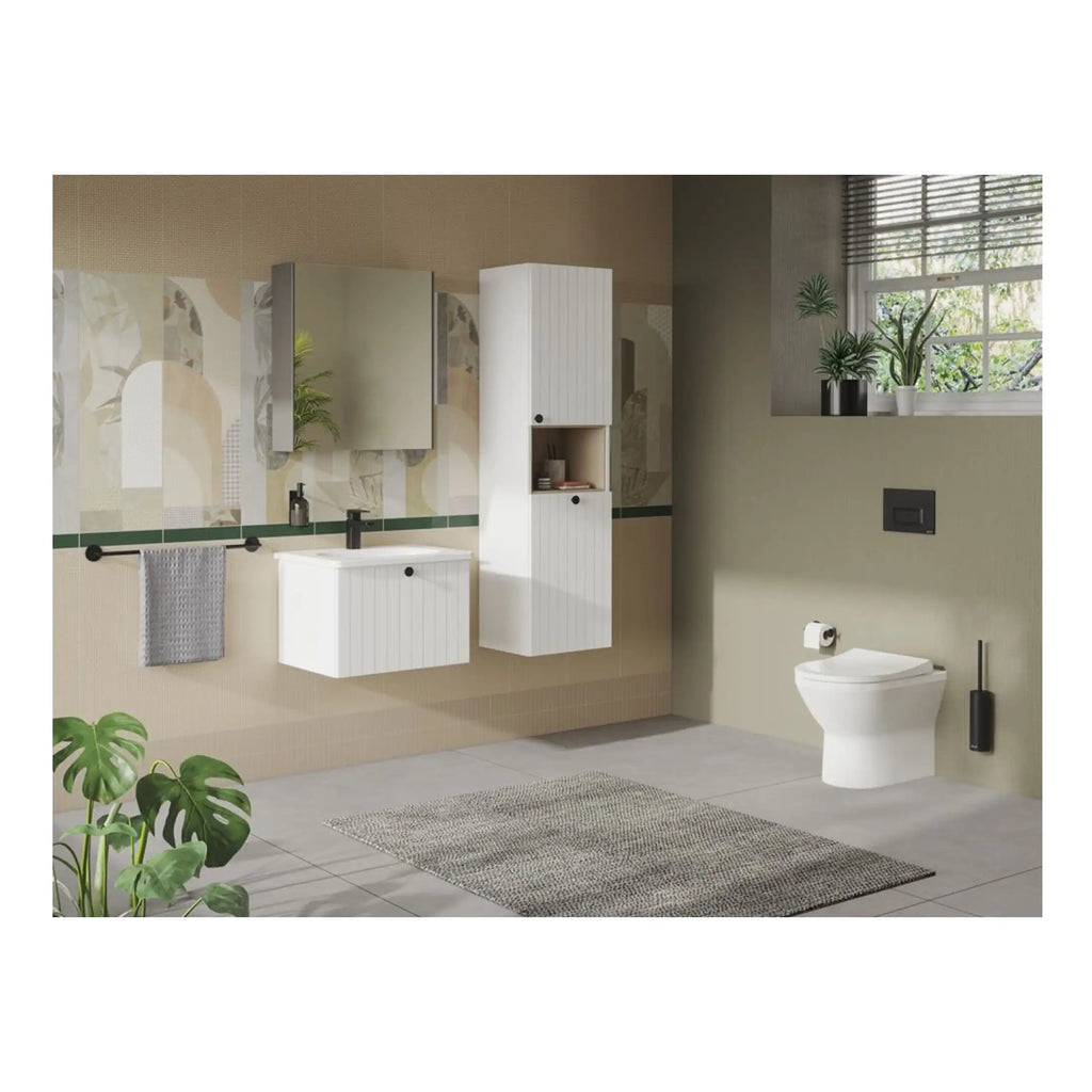 Contemporary white bathroom vanity with mirror, wall-mounted cabinet, and toilet in a modern, minimalist bathroom with botanical accents and natural light.