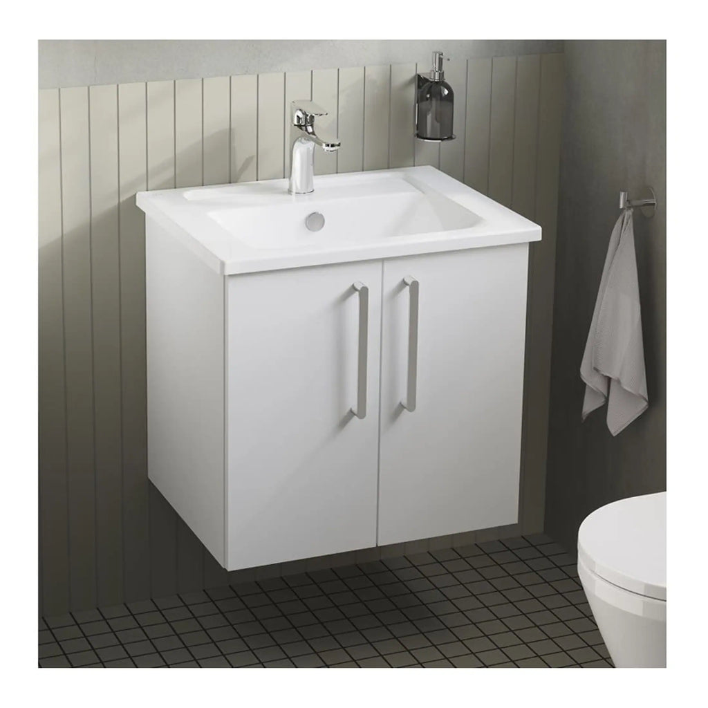 Modern white bathroom vanity with sink, chrome faucet, and storage cabinet, in a contemporary bathroom setting.