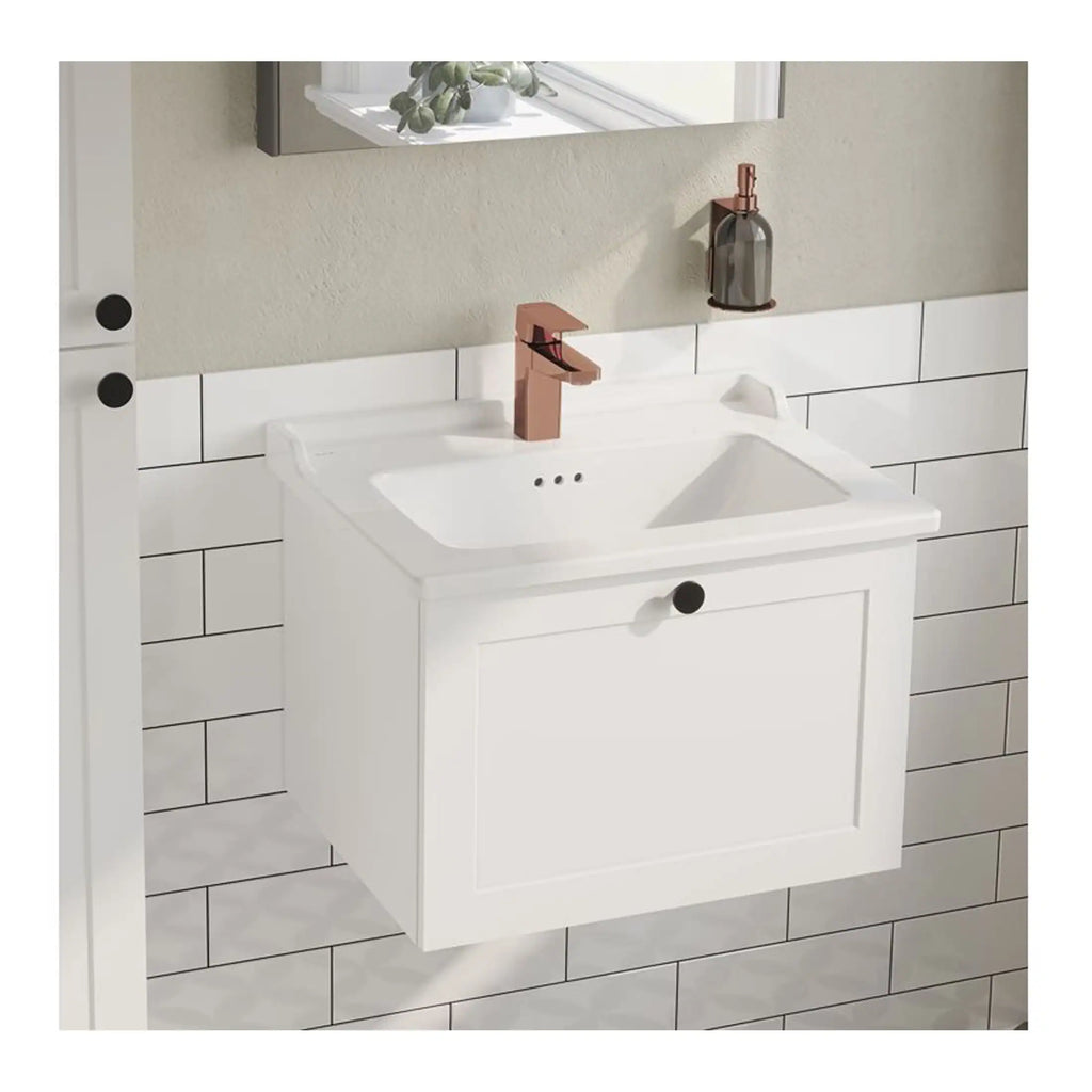 Modern white bathroom vanity with rectangular sink and rose gold faucet, mounted on a tiled wall with decorative accessories, ideal for contemporary bathroom interiors.