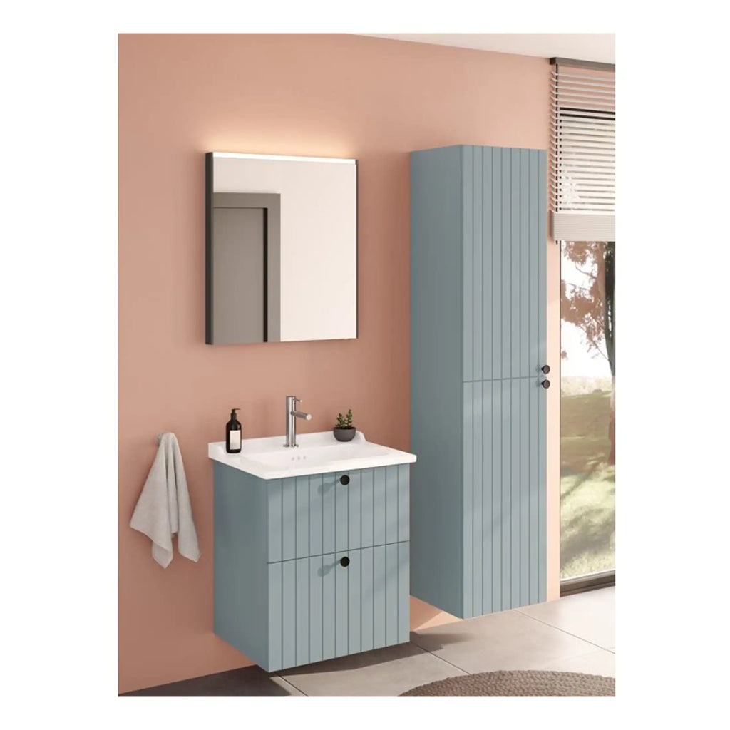 Bright blue bathroom furniture with a vanity unit, tall cabinet, and a modern wall mirror, designed for contemporary Bubly Bathrooms interiors in a stylish, functional home setting.