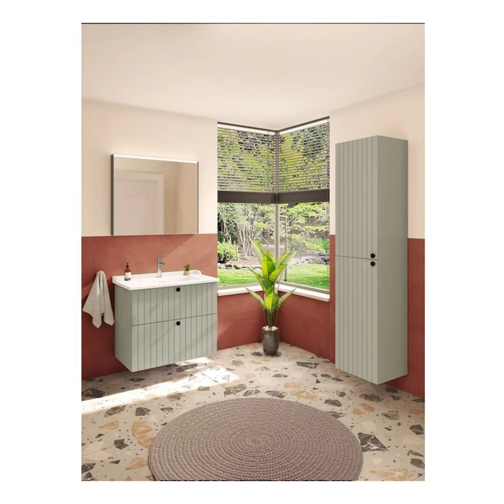 Modern bathroom vanity and tall storage cabinets in soft pastel green with vertical slat design, set against a warm terracotta half-wall and terrazzo flooring, with large window overlooking garden.