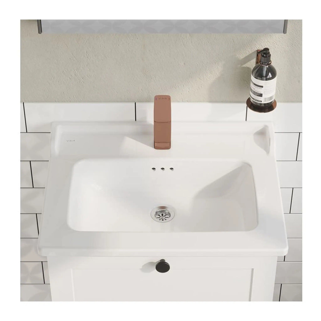 White bathroom sink with modern design and faucet, mounted on tiled wall, featuring soap dispenser on side, ideal for contemporary bathroom renovations and stylish bathroom fixtures, part of Bubly Bathrooms collection.