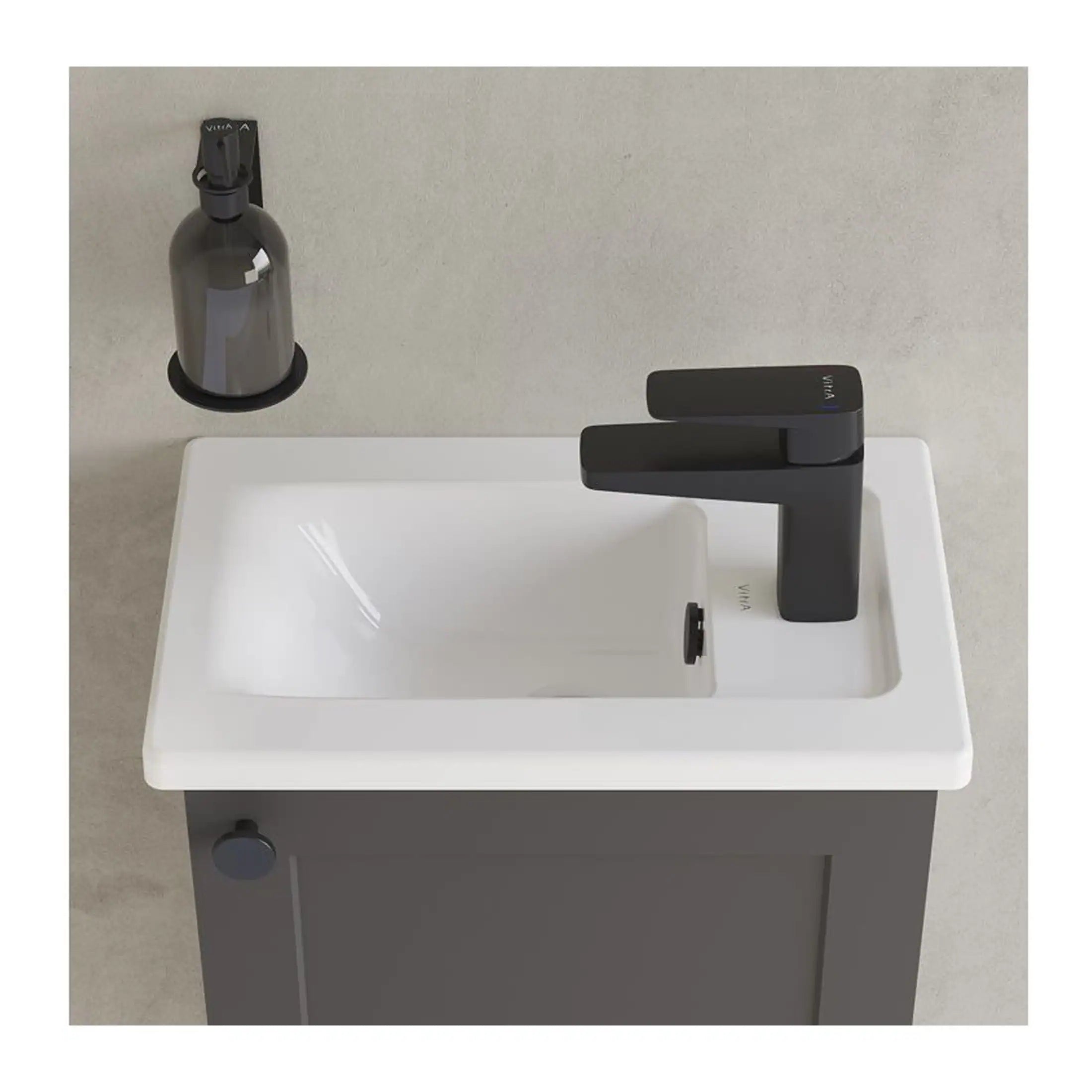 Sleek modern bathroom sink with black faucet and grey cabinet, ideal for contemporary bathroom designs, featuring high-quality materials and functional design.