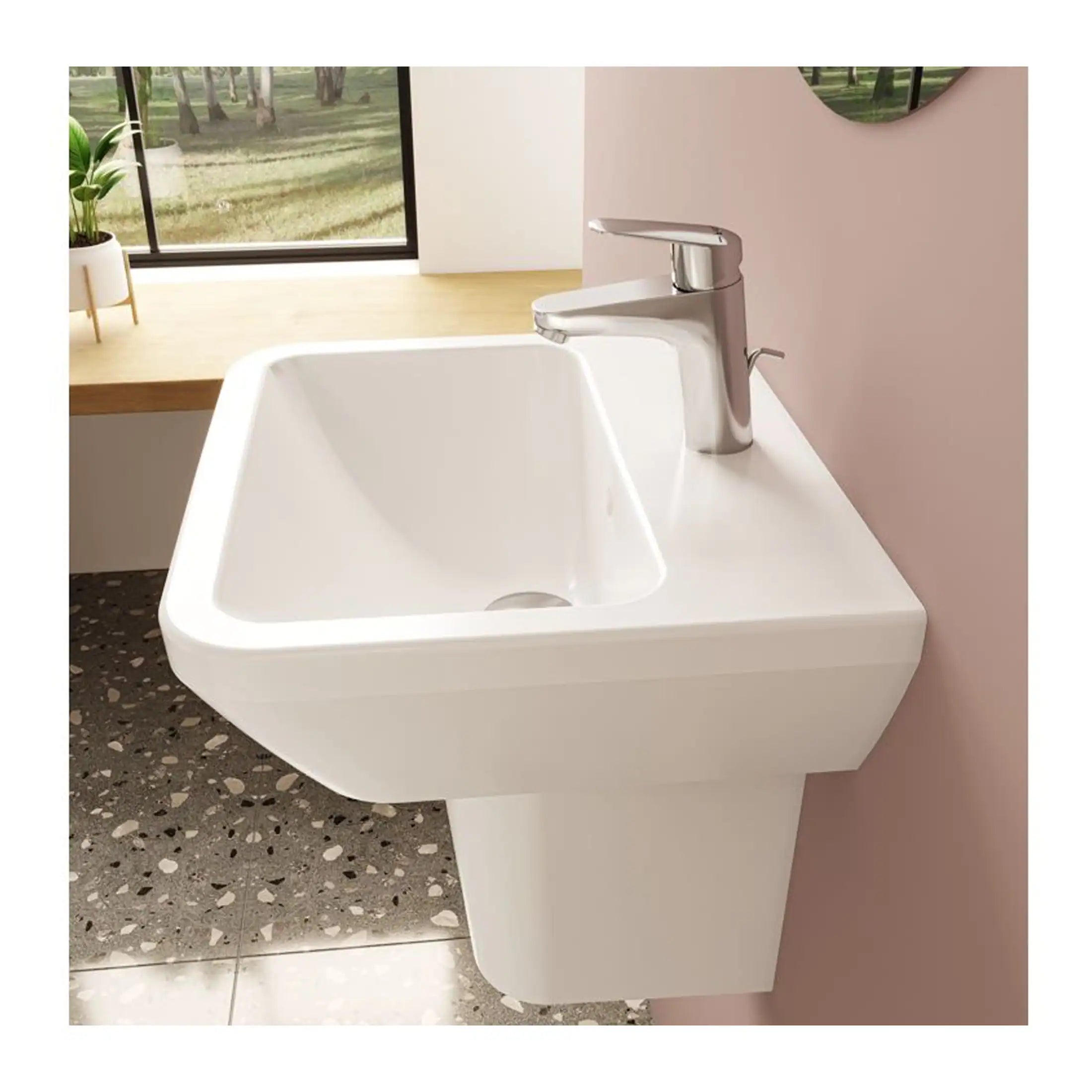 Sleek white bathroom sink with chrome faucet mounted on a wall, modern design ideal for contemporary bathrooms, with natural light and minimalist decor.