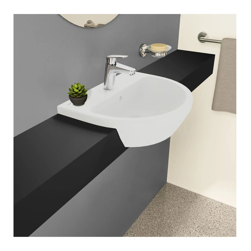 Sleek modern bathroom sink with black shelf and chrome faucet, decorated with a small succulent plant, designed for contemporary bathroom aesthetics and efficient space use.