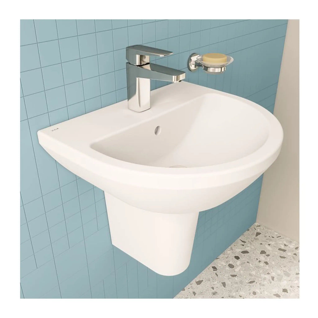 Chrome bathroom sink with modern faucet on blue tiled wall, perfect for contemporary bathroom design and renovation.