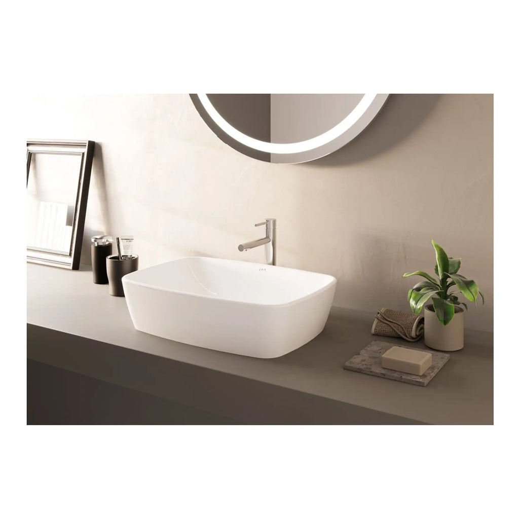 Sleek modern white bathroom sink with minimalist design, paired with contemporary fixtures, a mirror with integrated lighting, and stylish accessories for a clean and elegant bathroom decor.