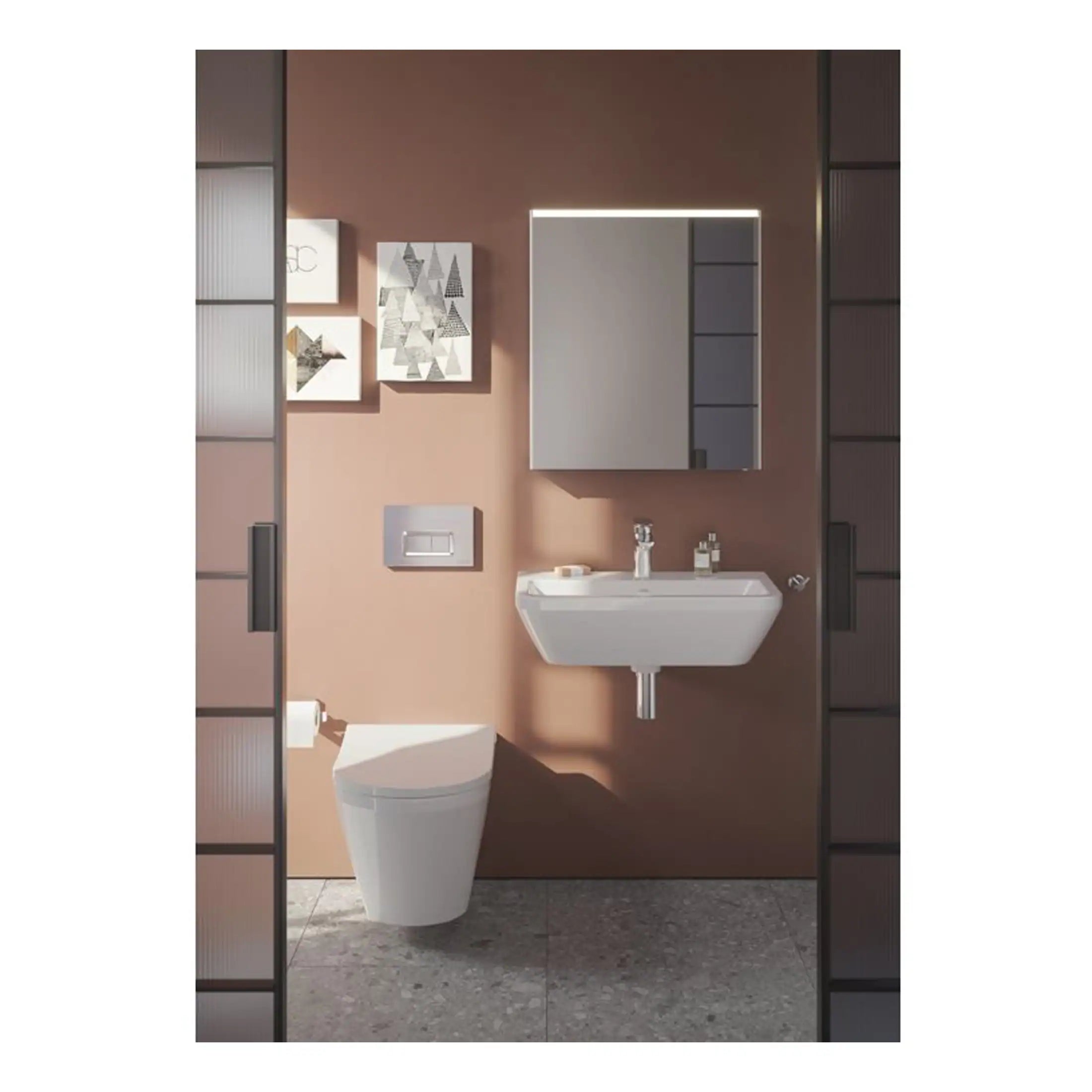 Sleek modern bathroom with wall-mounted toilet, minimalist sink, large illuminated mirror, neutral tones, contemporary decor, and stylish cabinetry, creating a functional and elegant space.