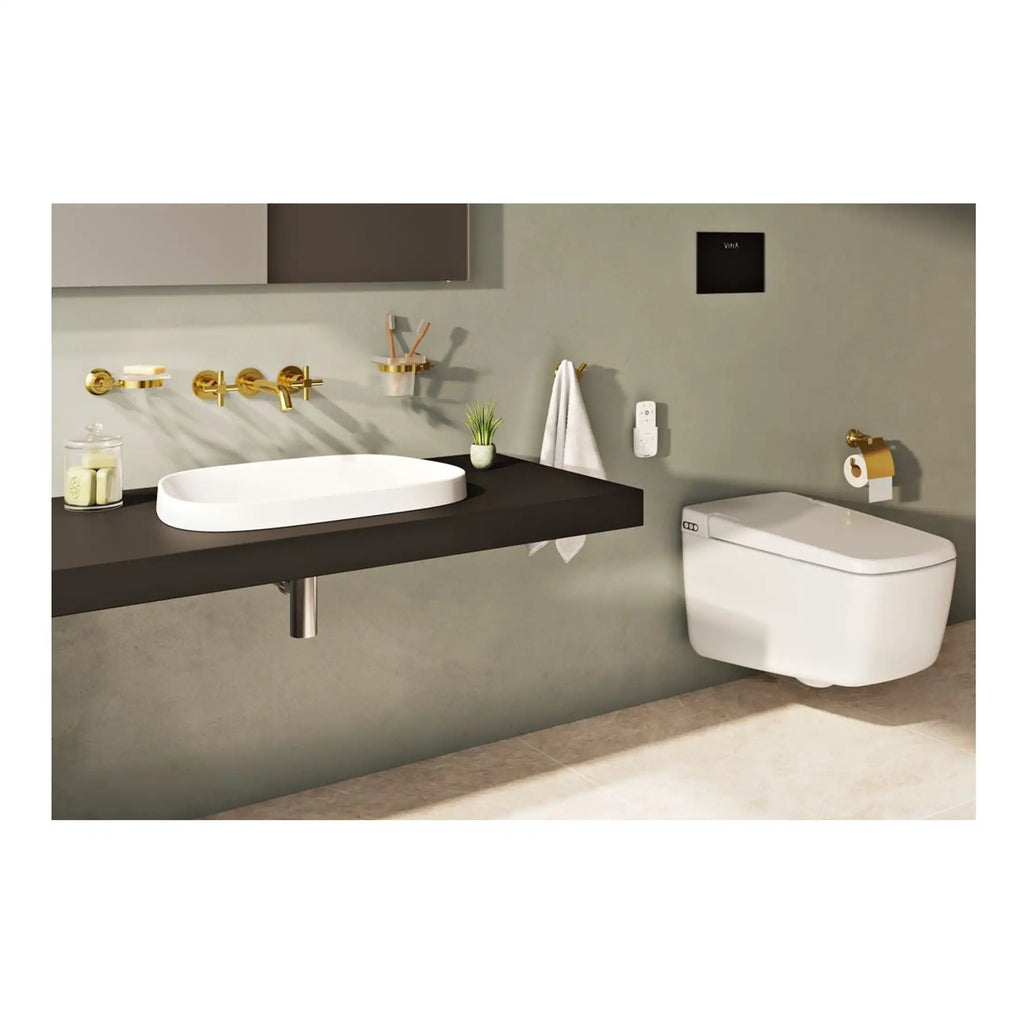 Sleek modern bathroom with wall-mounted toilet and vessel sink featuring gold fixtures, minimalist design, and neutral colour palette for contemporary bathroom aesthetics.