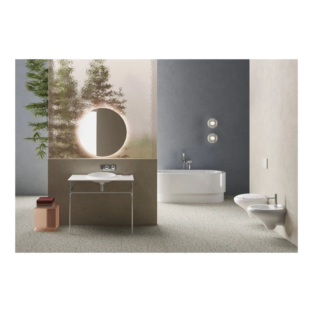 Sleek modern bathroom design featuring a stylish white basin, freestanding bathtub, wall-mounted toilet and bidet within a minimalist space with contemporary design elements.